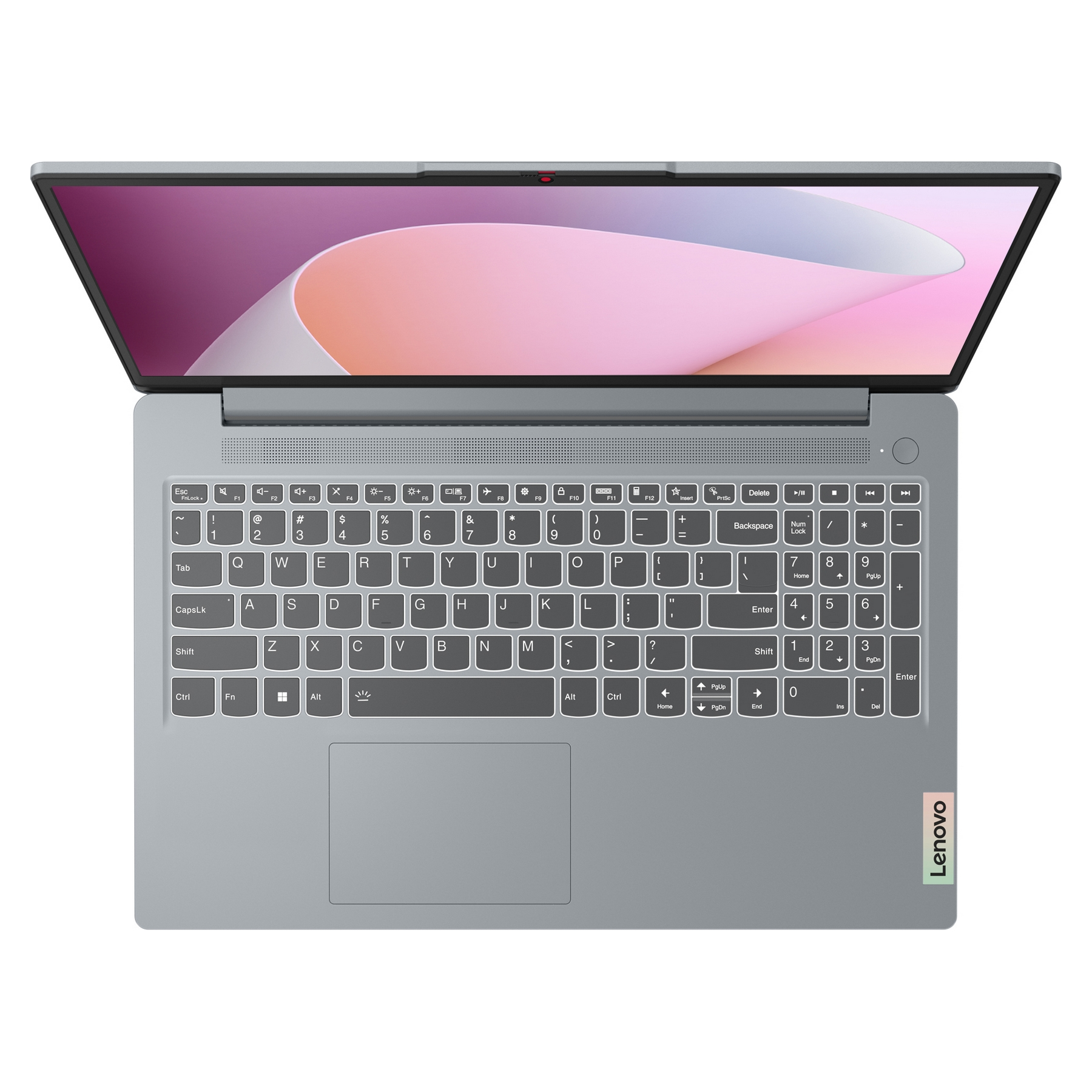 Laptop con schermo aperto, che mostra un design rosa e bianco. Tastiera visibile. Logo Lenovo in basso a destra.