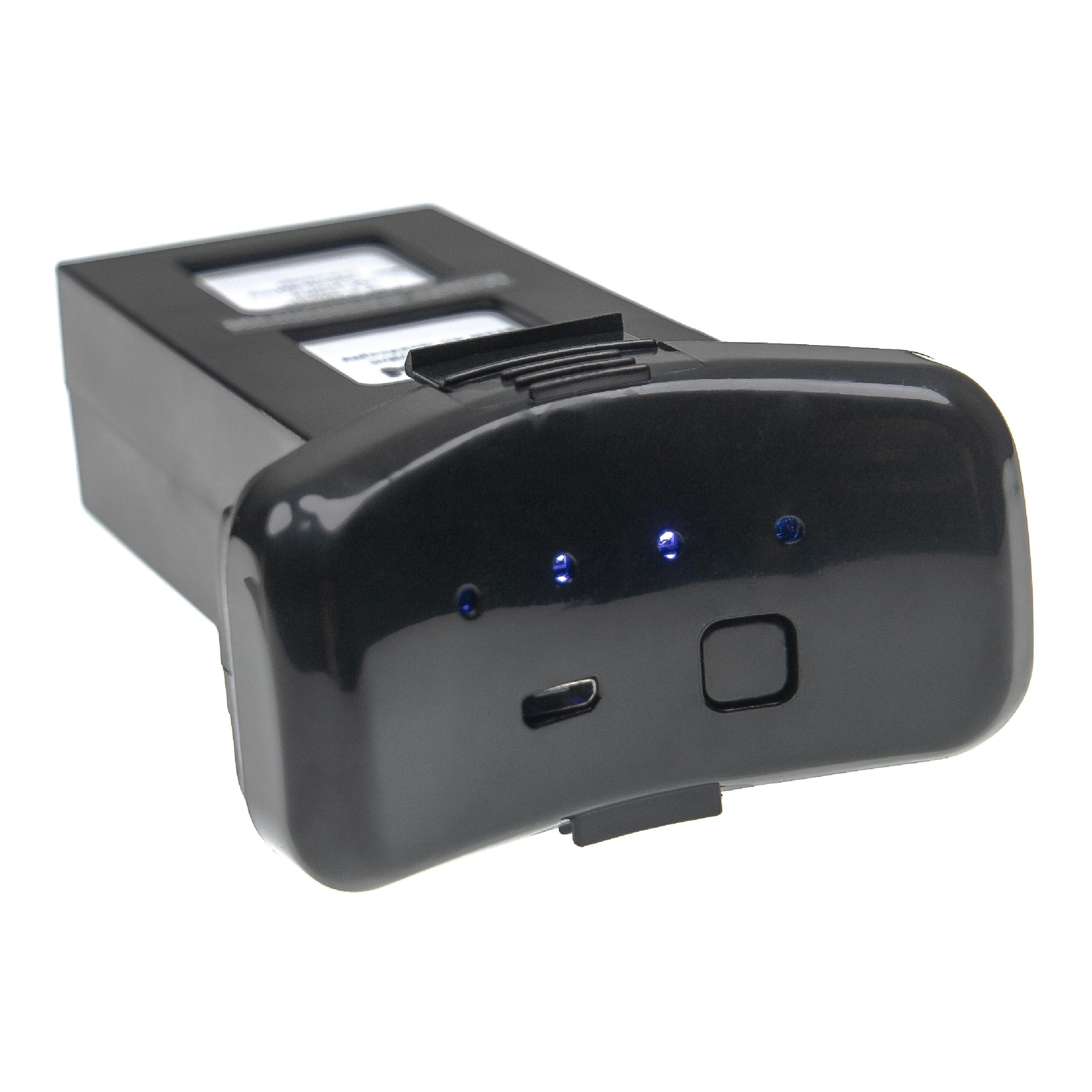 Schwarzer Drohnenakku mit drei blauen Lichtern, einem USB-Anschluss und einem Einschaltknopf auf weißem Hintergrund.