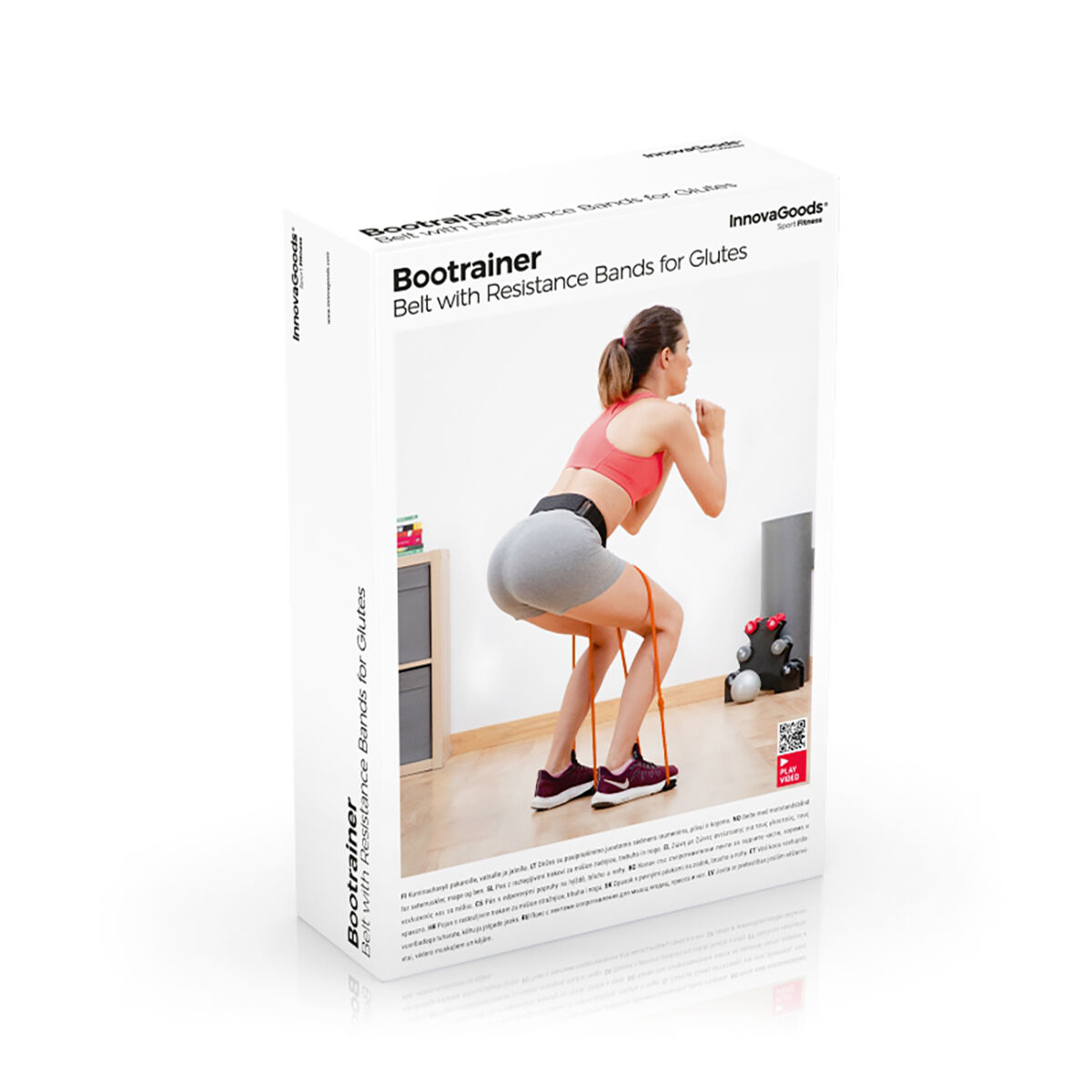 Eine Frau in Sportkleidung demonstriert die Verwendung von Widerstandsbändern, die an einem Gürtel befestigt sind. Die Produktverpackung ist im Hintergrund.