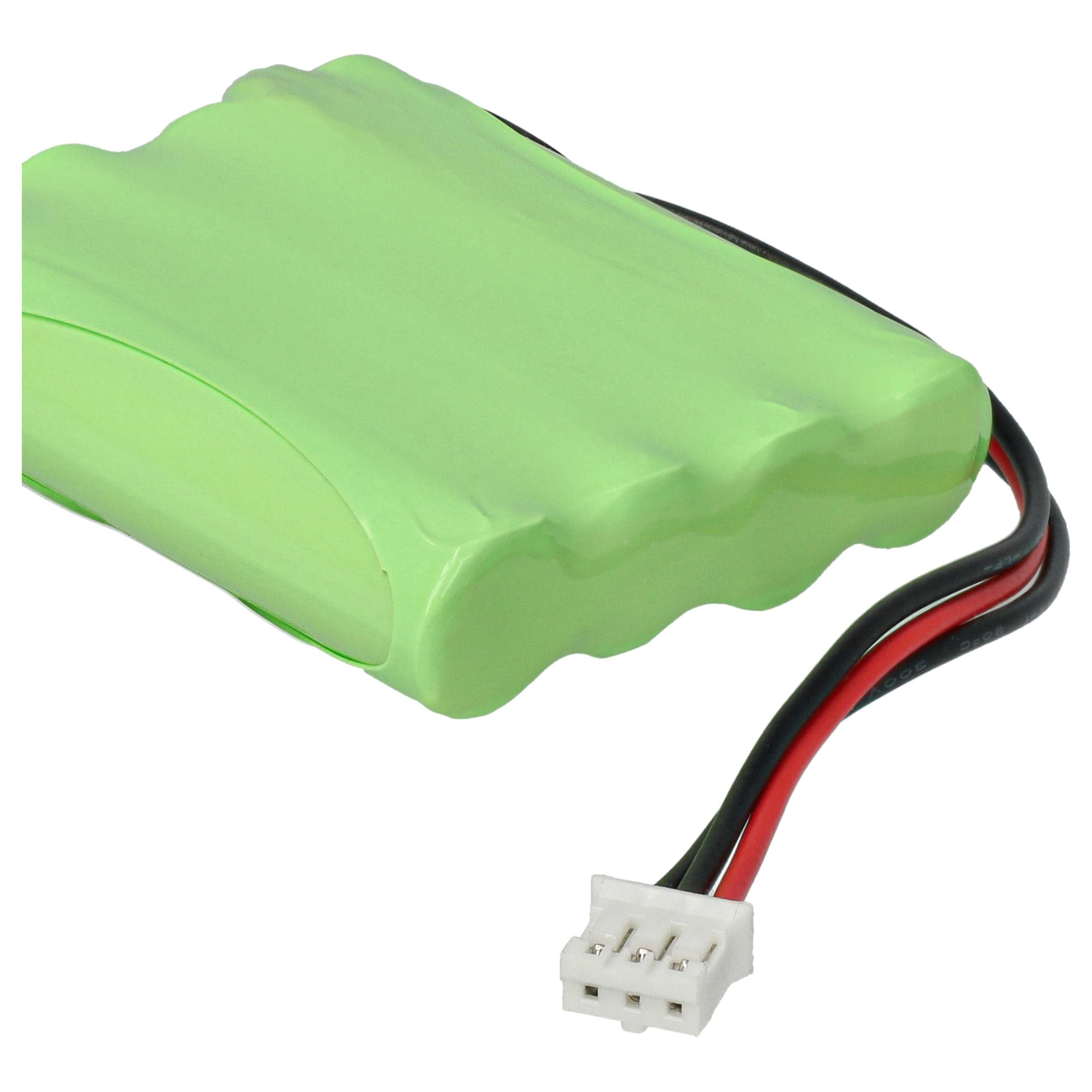 Ein grünes Batteriepack mit drei schwarzen und einem roten Draht, die an einen weißen Stecker angeschlossen sind.