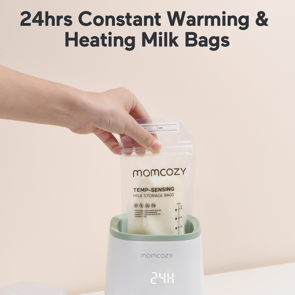 A hand placing a Momcozy milk storage bag into a warmer. The bag is transparent and contains milk. The warmer is white and green.