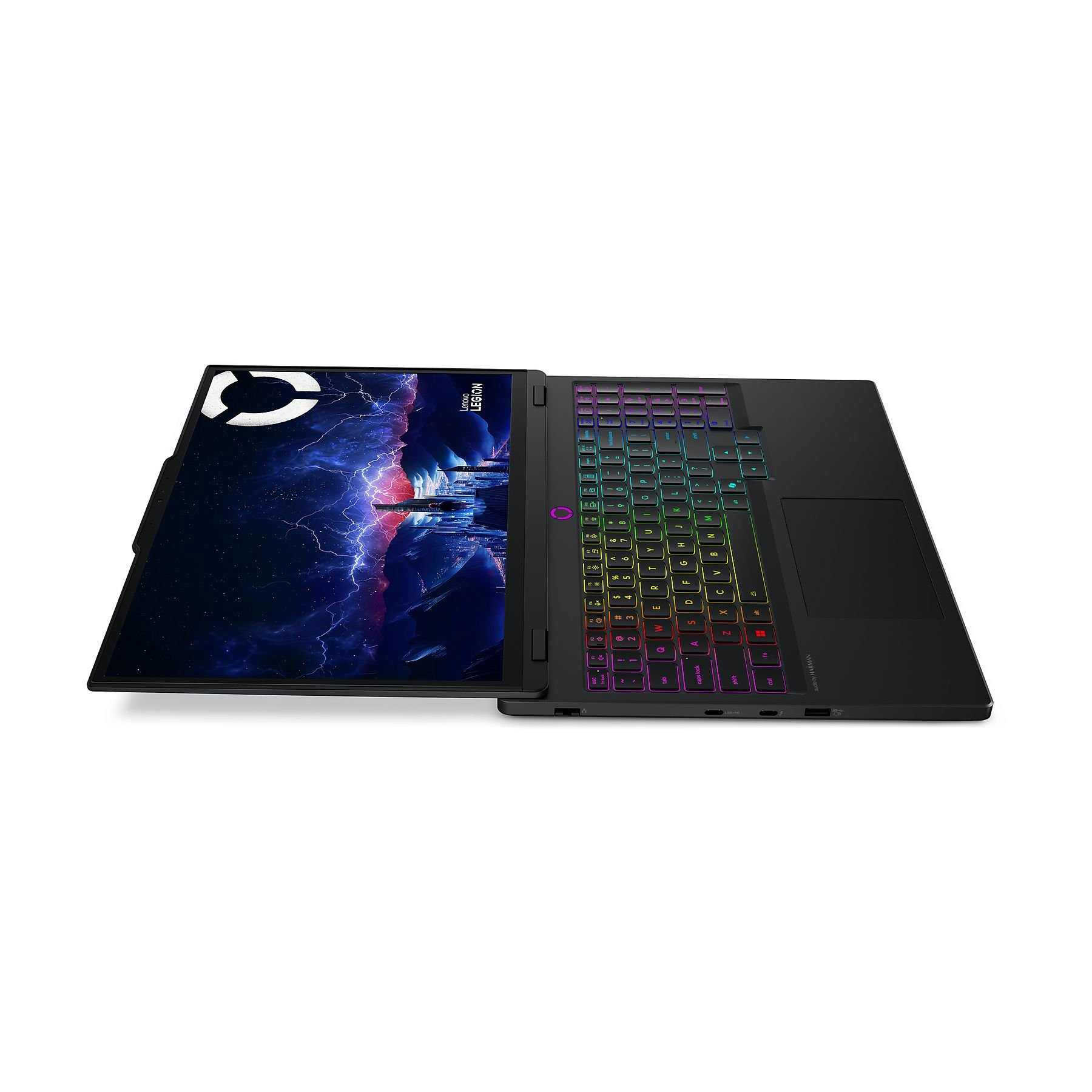 Laptop Lenovo Legion nero aperto su sfondo bianco. Lo schermo mostra una scena scura e tempestosa. La tastiera ha tasti colorati.