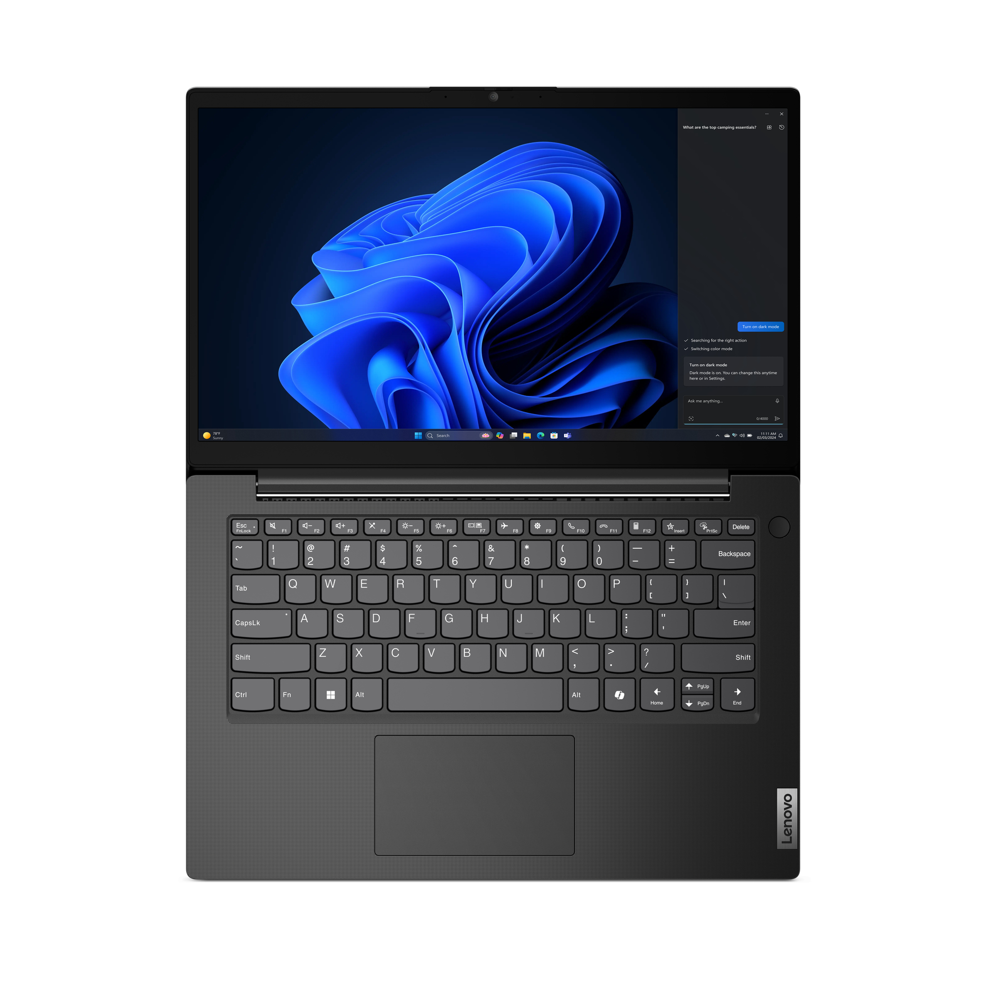 Laptop nero con schermo illuminato, che mostra un design astratto blu scuro e un'interfaccia Windows. Tastiera visibile.