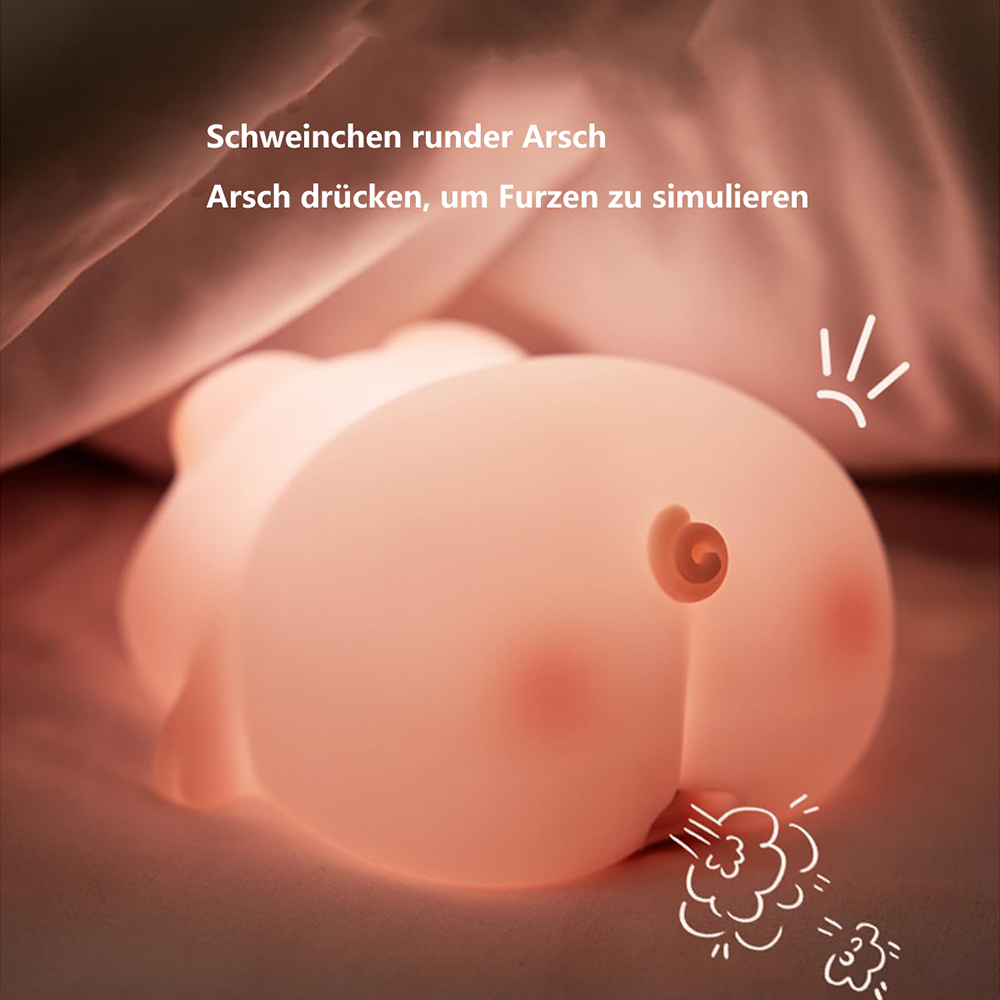 Ein rosa, hinternförmiges Nachtlicht mit Wirbeldetail. Weiße Furz-Illustration. Text oben: "Runder Schweinehintern".