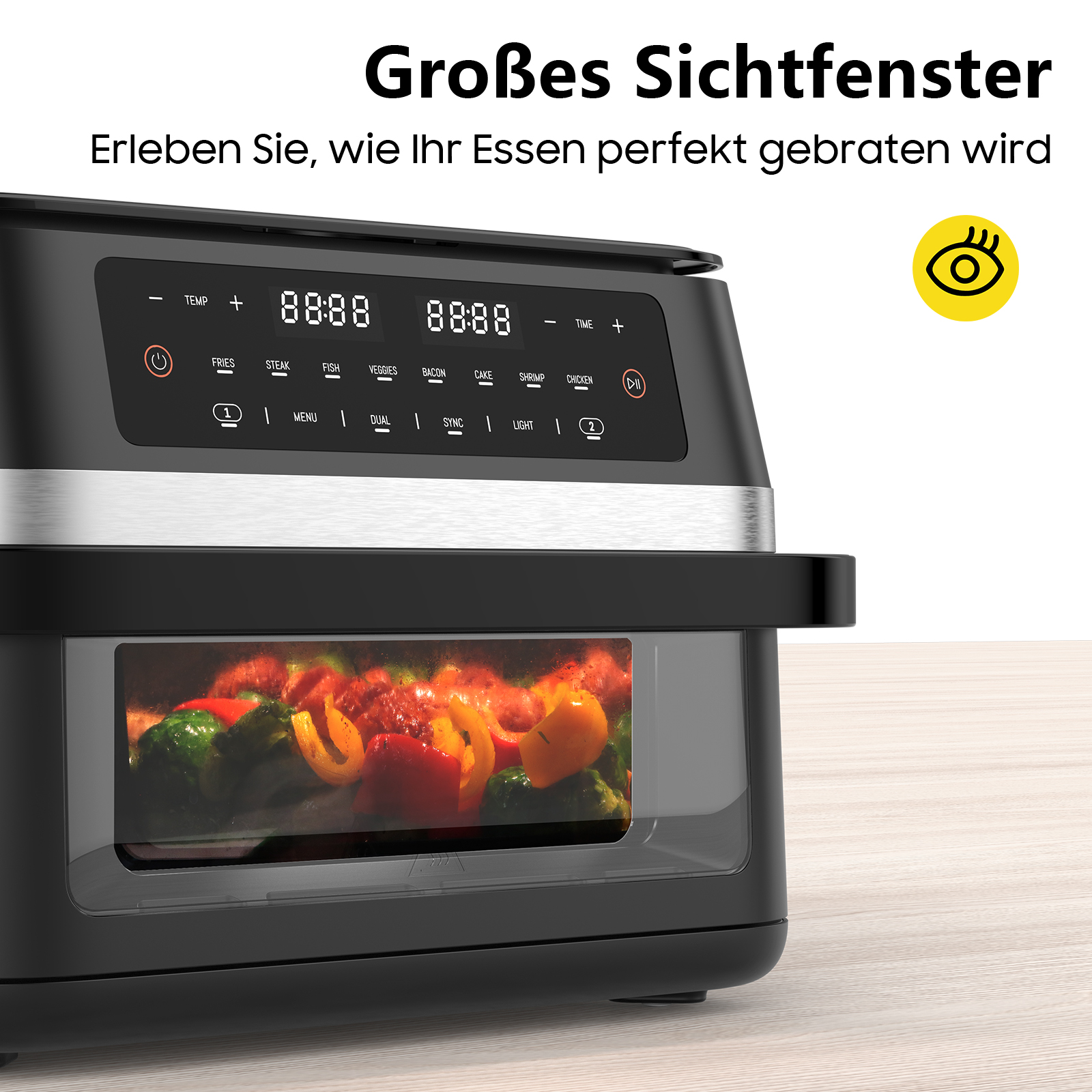 Schwarze Heißluftfritteuse mit Glasfenster. Im Inneren befindet sich gekochtes Gemüse. Das Display zeigt Zahlen und Funktionstasten.