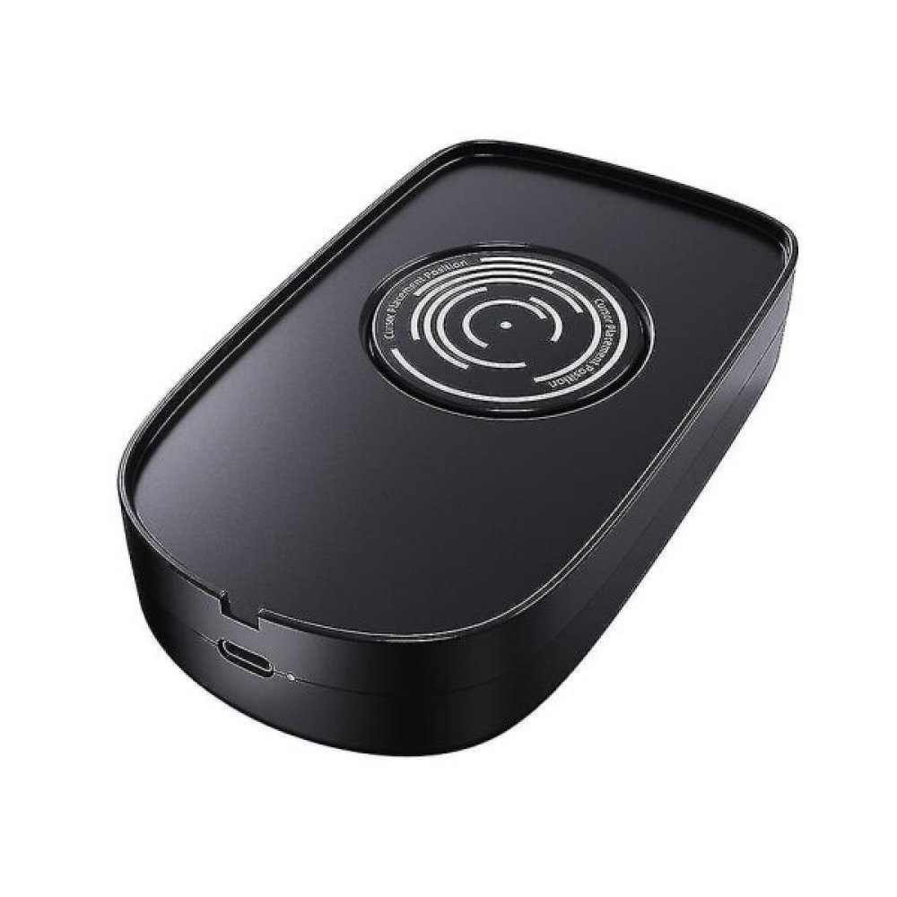 Ein schwarzes kabelloses Ladegerät mit kreisförmiger Ladefläche. Das Ladegerät hat einen USB-Anschluss und die Worte 'Center Placement Position'.