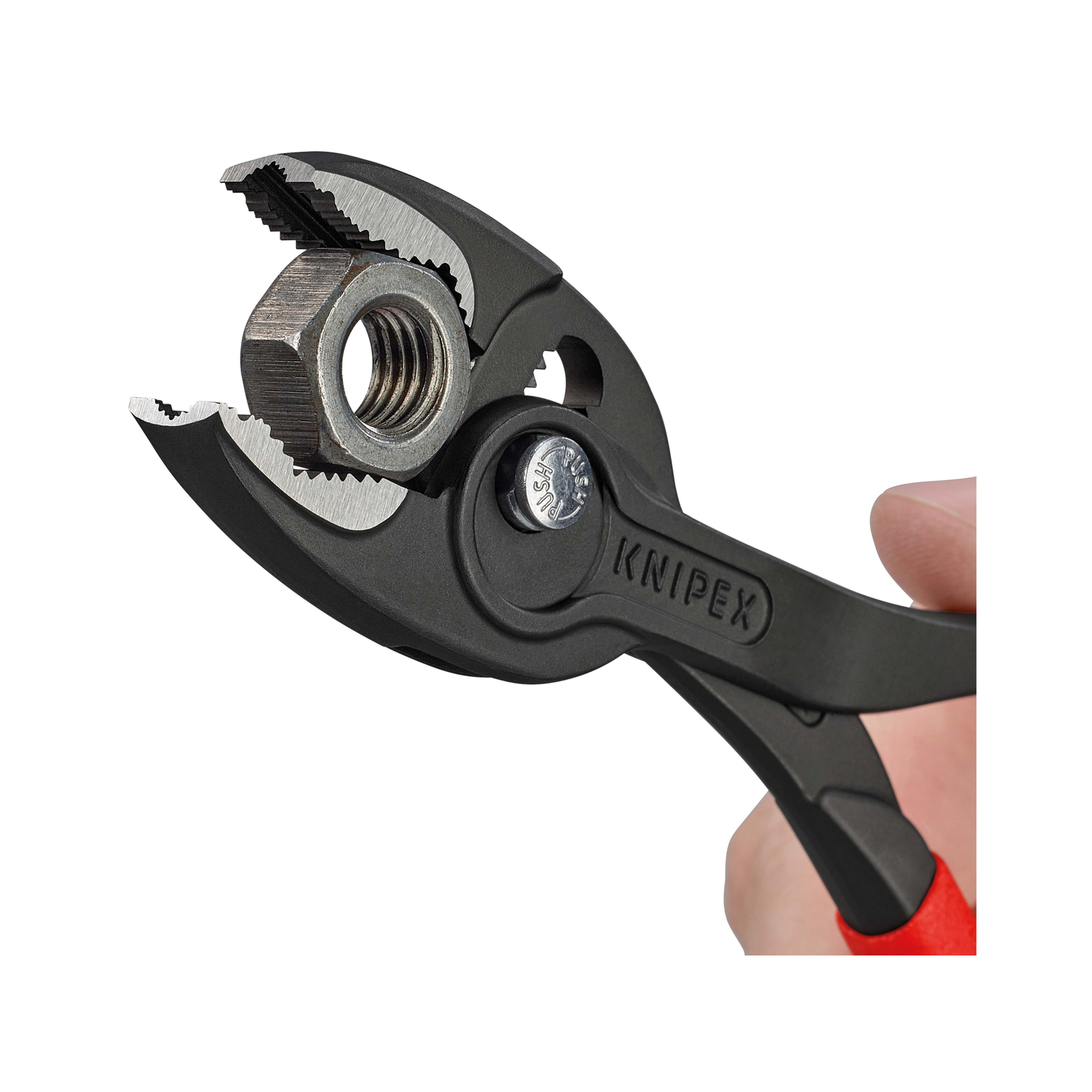 Czarne szczypce trzymające metalową nakrętkę. Szczypce mają napis KNIPEX. Ręka trzyma szczypce.