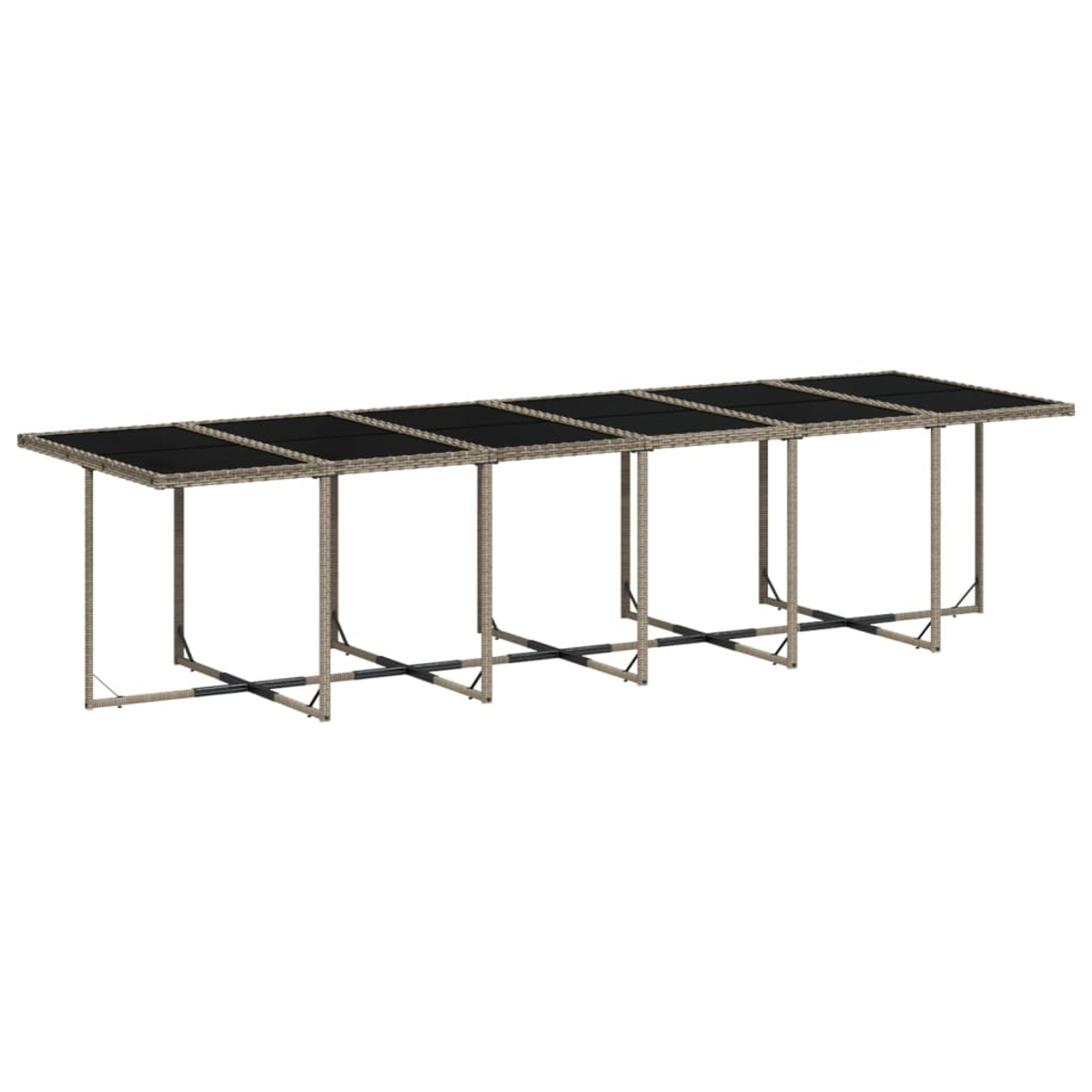 Ein langer Outdoor-Tisch mit dunkler Oberseite und hellbraunen Korbstuhlbeinen. Es hat mehrere rechteckige Abschnitte und ein schlichtes Design.
