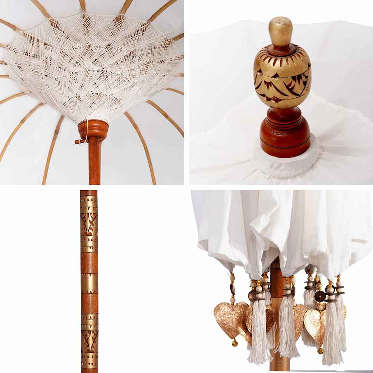Dettagli di un ombrello bianco e in legno. Include la parte superiore, l'impugnatura in legno intagliato, l'asta con design dorato e decorazioni a cuore pendenti.