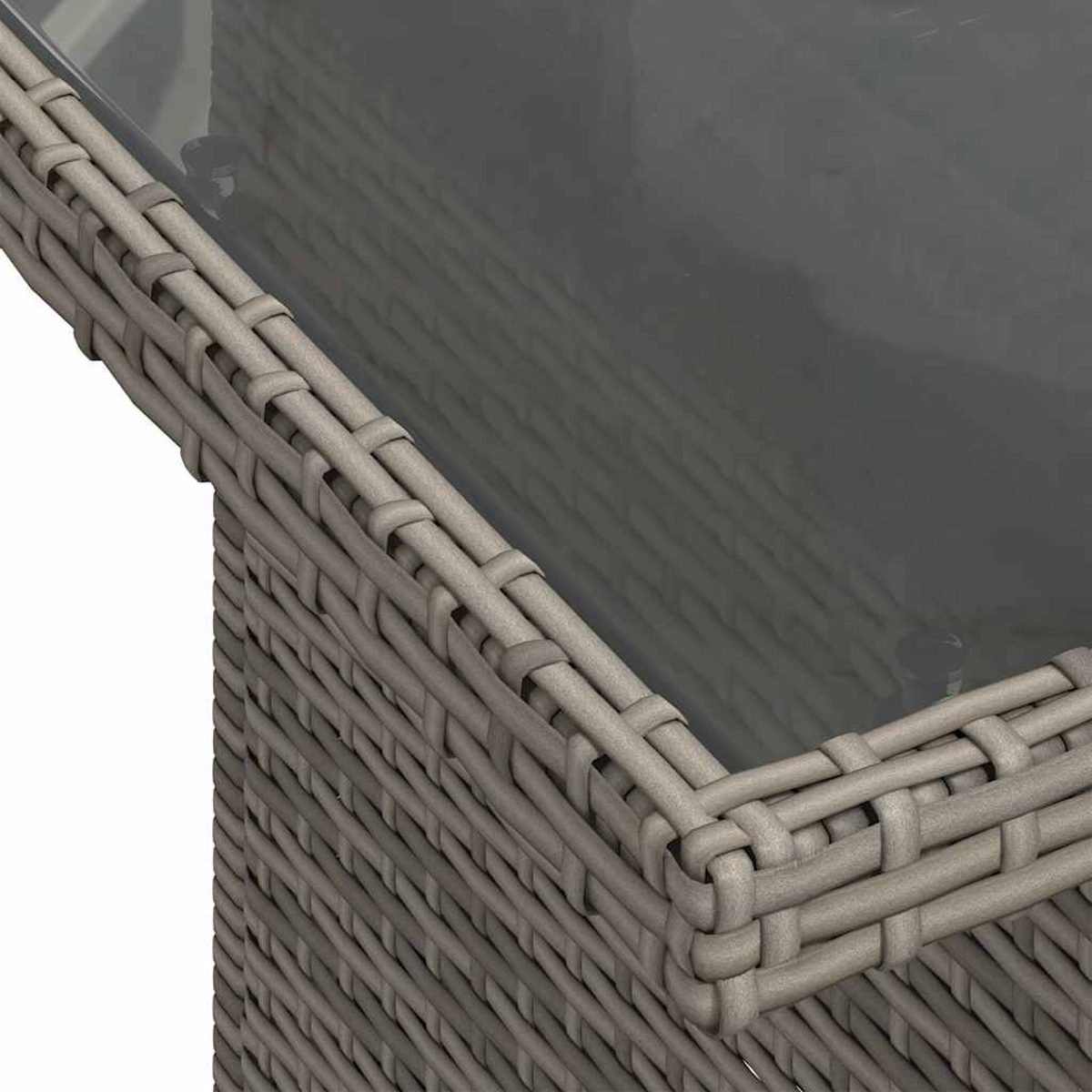 Nahaufnahme einer grauen, gewebten Tischkante mit Glasplatte. Das Geflecht ist detailliert und das Glas reflektierend.