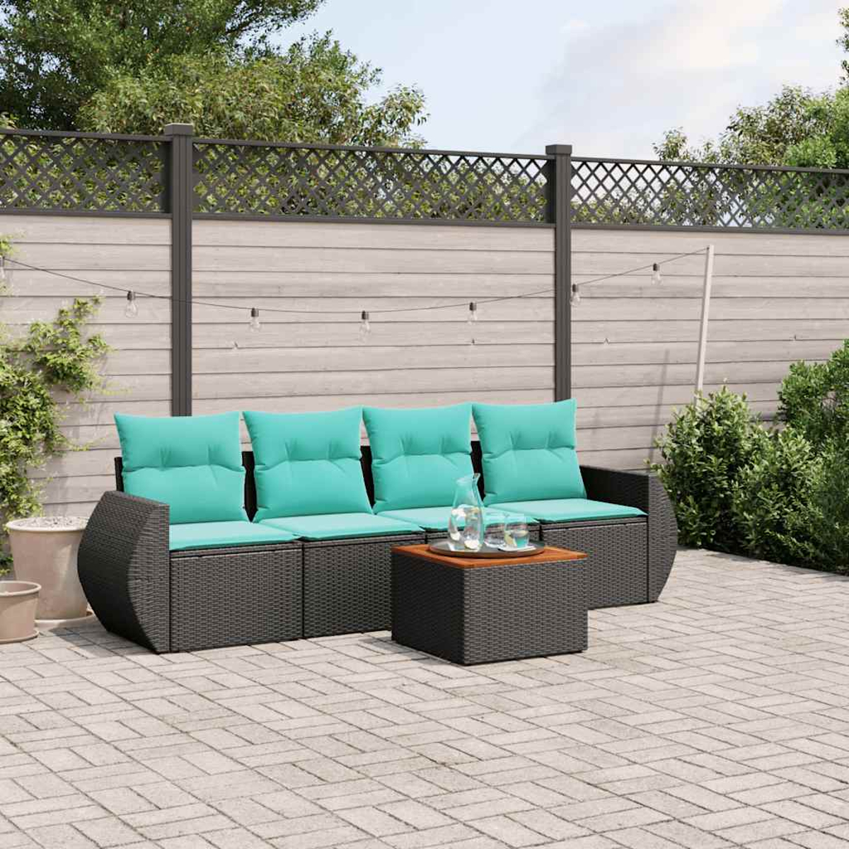 Gartenmöbel-Set mit tealfarbenen Kissen, einem kleinen Tisch und einem Holzzaun im Hintergrund.