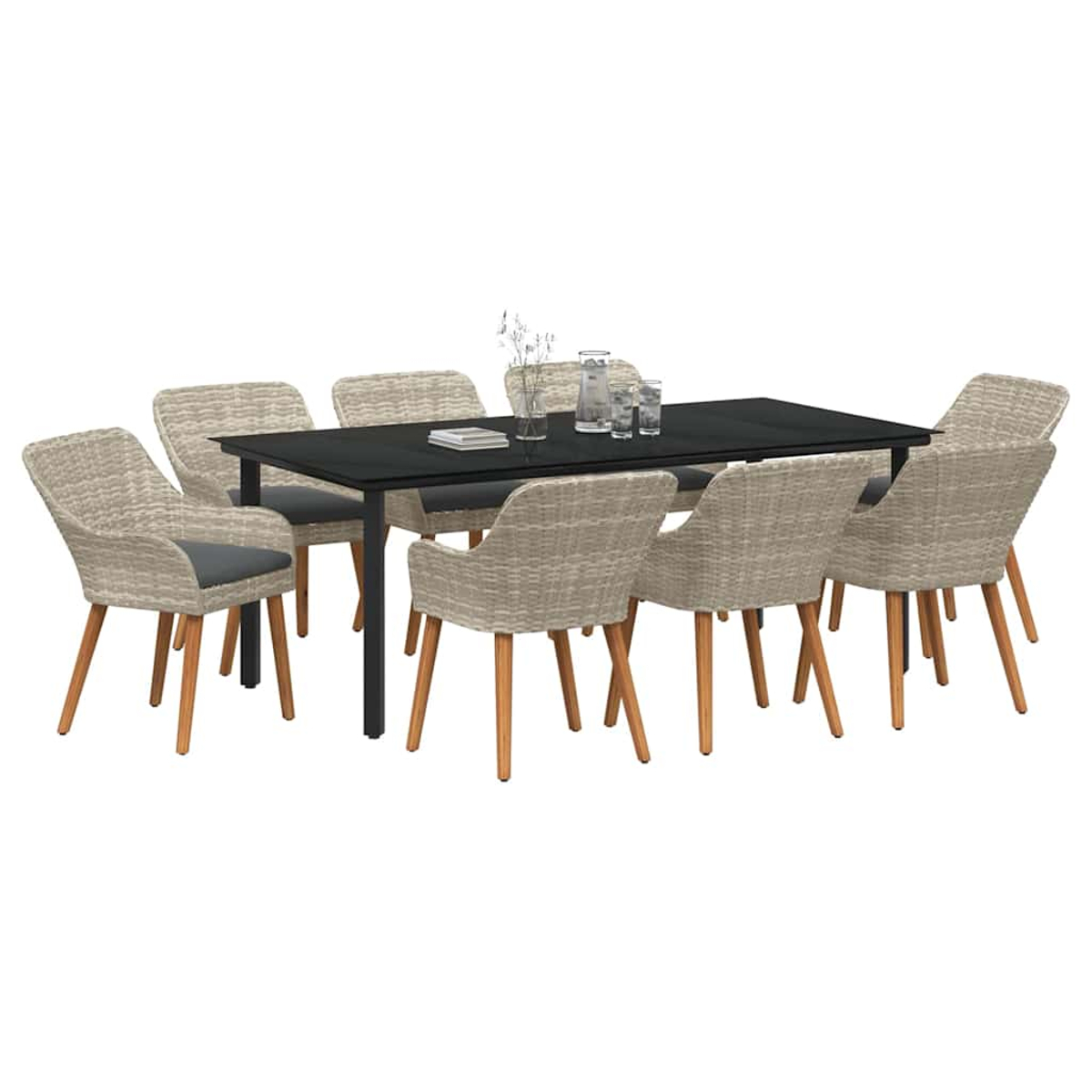 Essgruppe mit schwarzem rechteckigem Tisch, acht Korbstühlen und einem Glas Wasser und Blumen auf dem Tisch.