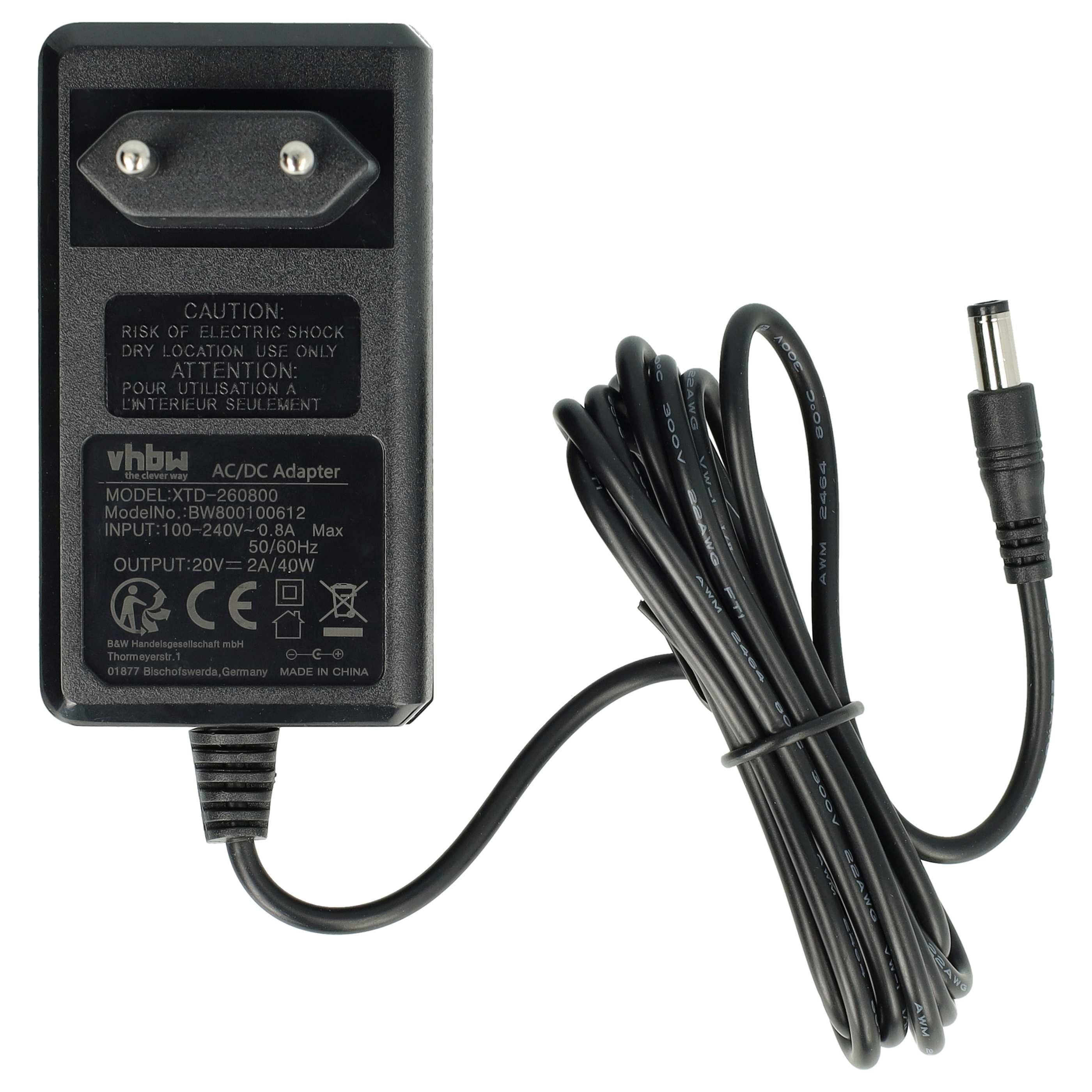 Ein schwarzes AC/DC-Adapter mit einem schwarzen Kabel und einem DC-Anschluss. Der Adapter hat Text und einen Stecker.