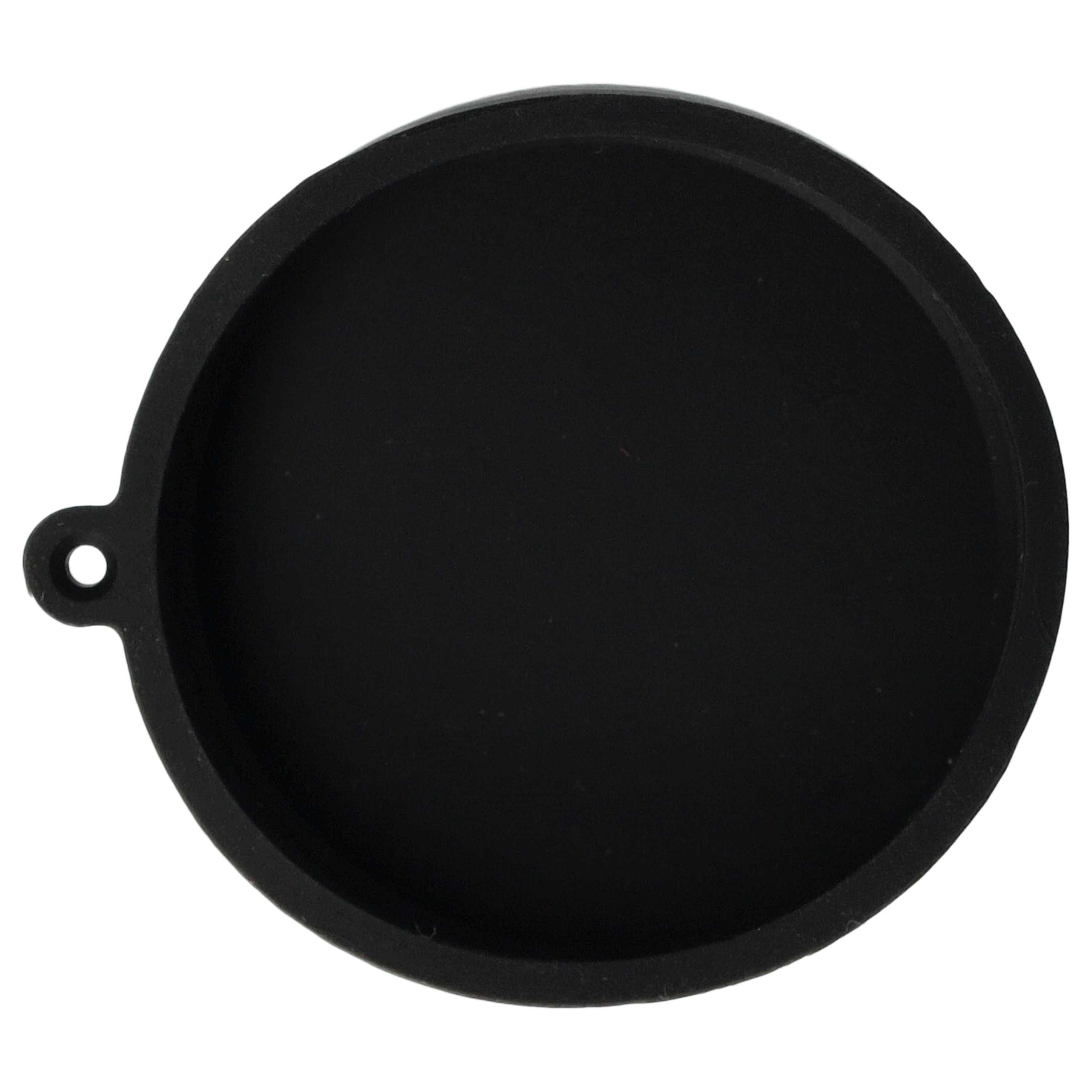 Ein schwarzes, kreisförmiges Objekt mit einem kleinen Loch und einem Vorsprung am Rand, vor weißem Hintergrund.