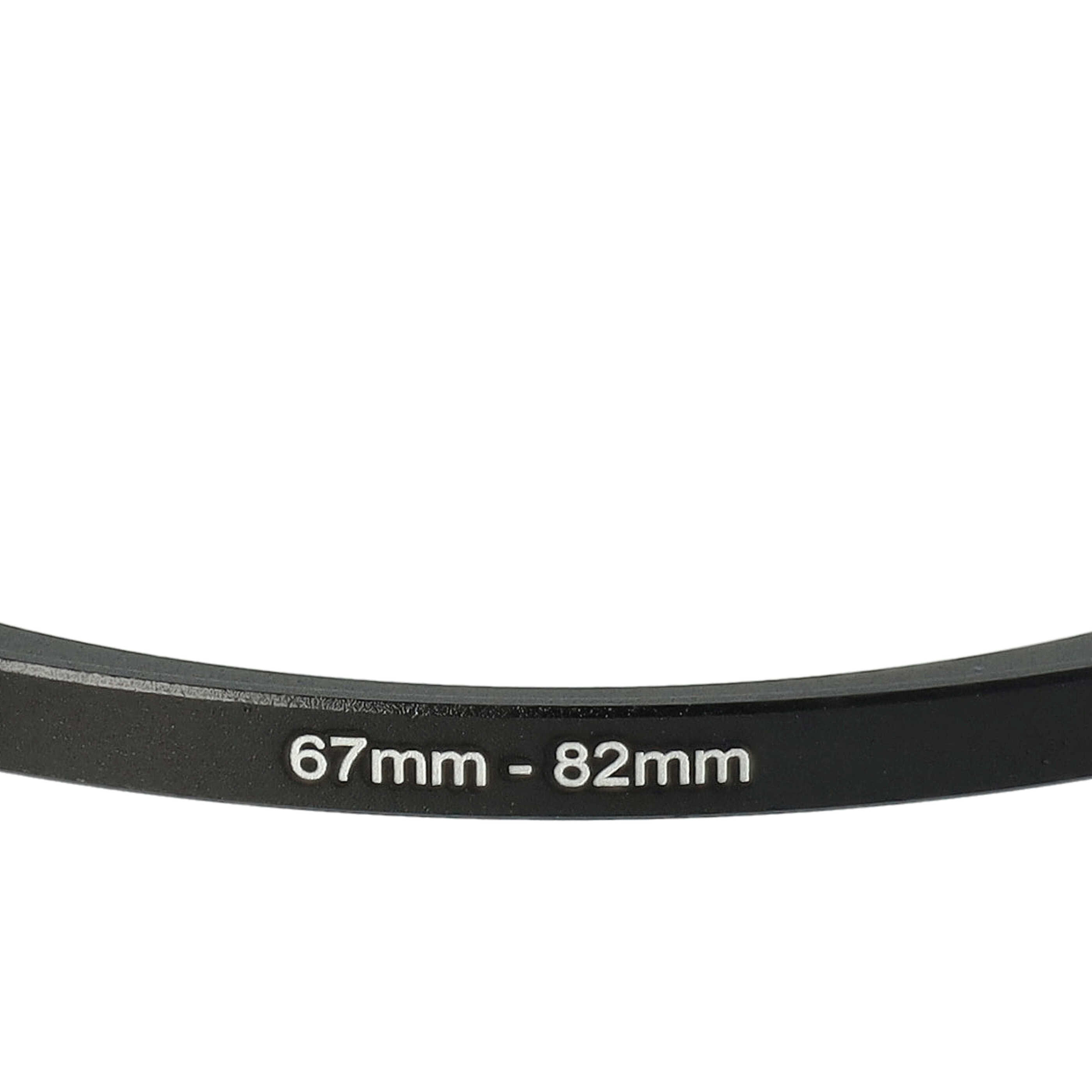 Ein schwarzer Ring mit weißem Text, der '67mm - 82mm' lautet, ist zentriert. Der Hintergrund ist weiß.