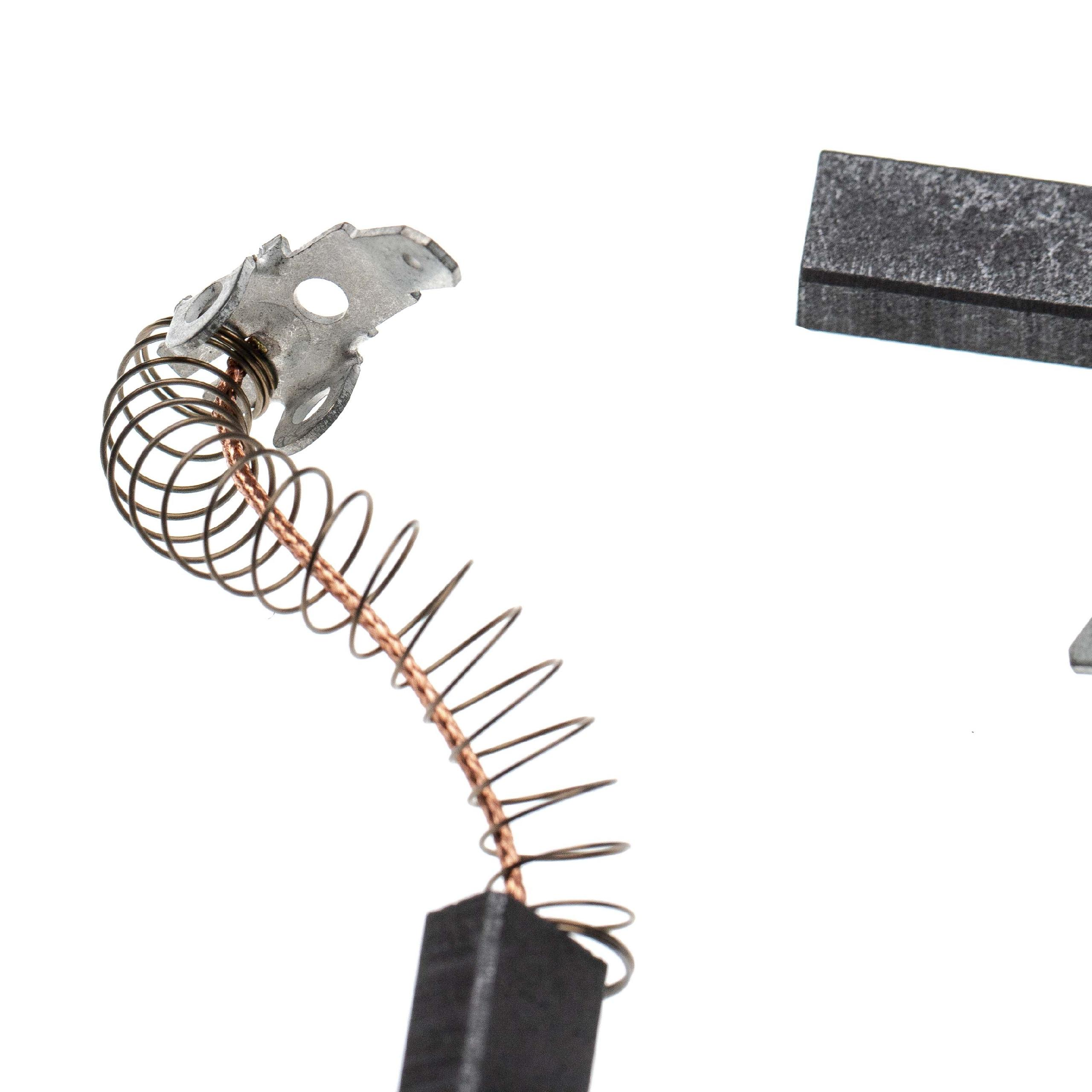 Nahaufnahme zeigt eine Kupferspiralfeder, die an einer Metallplatte und einem rechteckigen schwarzen Kohleblock befestigt ist. Weißer Hintergrund.
