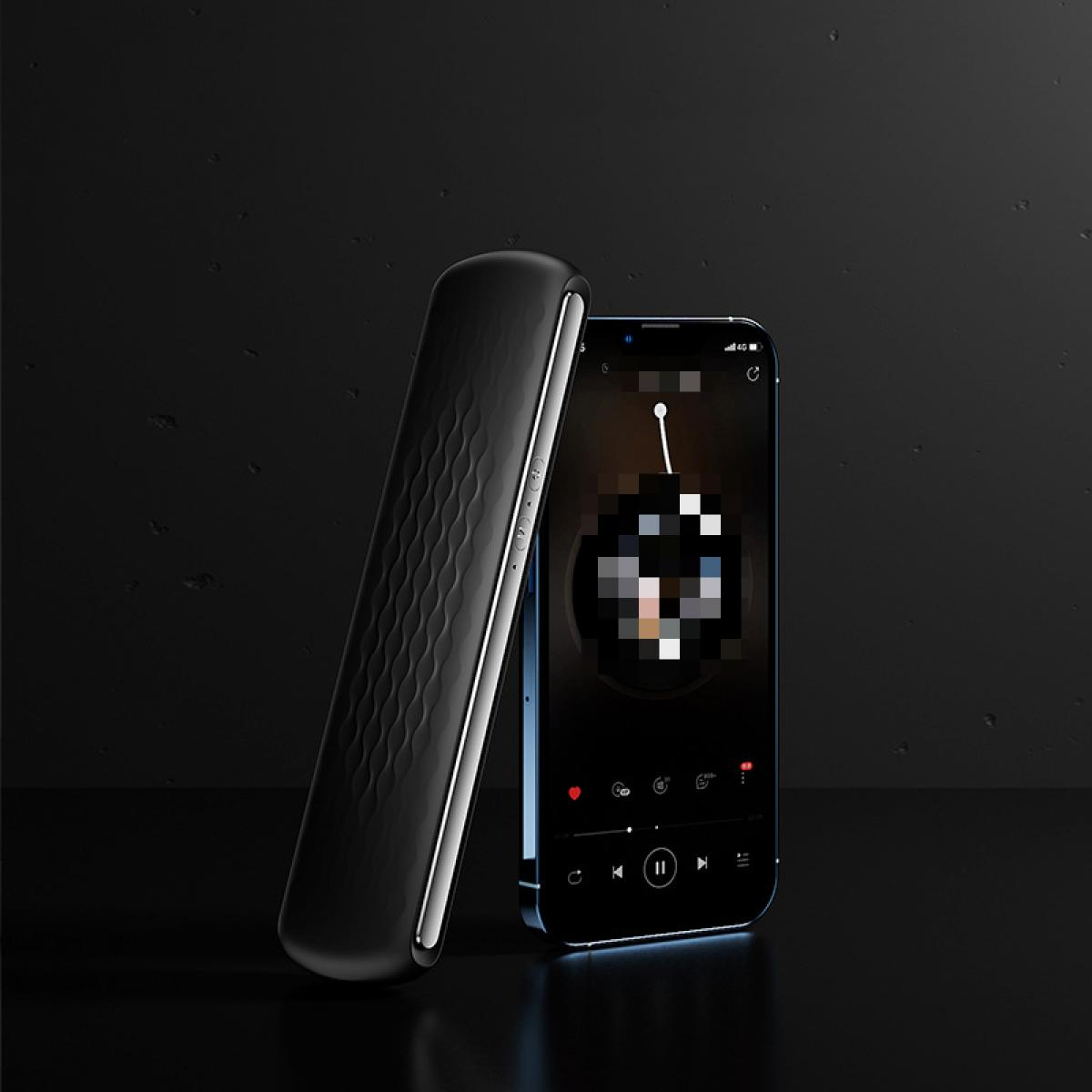Schwarzes, schlankes Telefon mit einem schwarzen Objekt, das sich dagegen lehnt, auf einer dunklen Oberfläche. Der Bildschirm zeigt Musiksteuerungen.
