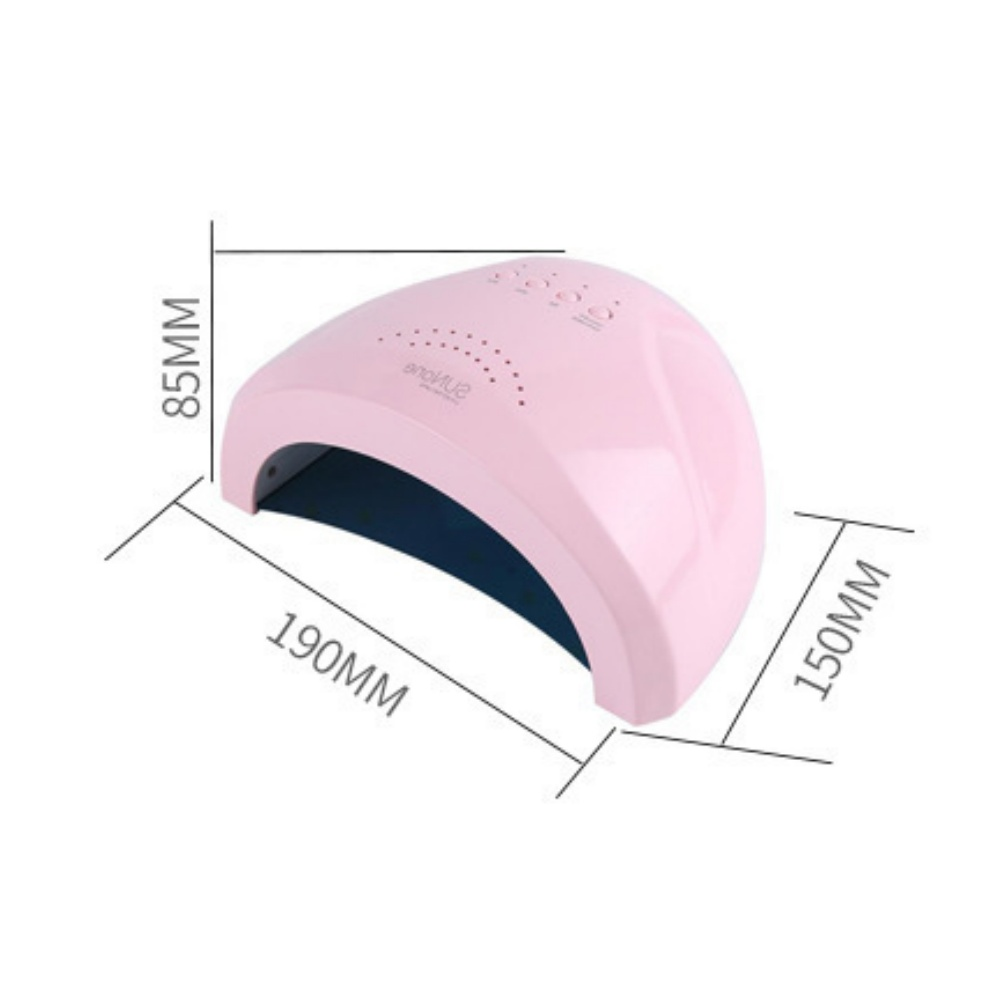 Eine rosa Nagellampe mit Maßangaben. Die Lampe hat eine gewölbte Oberseite, kleine Löcher und ein dunkelblaues Innere. Sie befindet sich auf weißem Hintergrund.