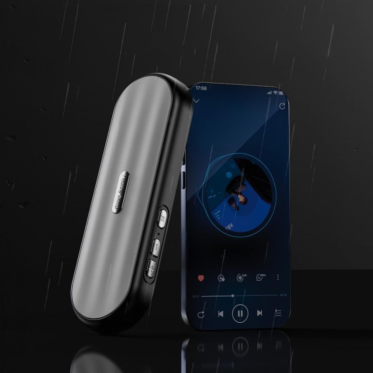 Ein silberner und schwarzer Audioplayer und ein Smartphone mit einer Musik-App-Oberfläche vor dunklem Hintergrund.