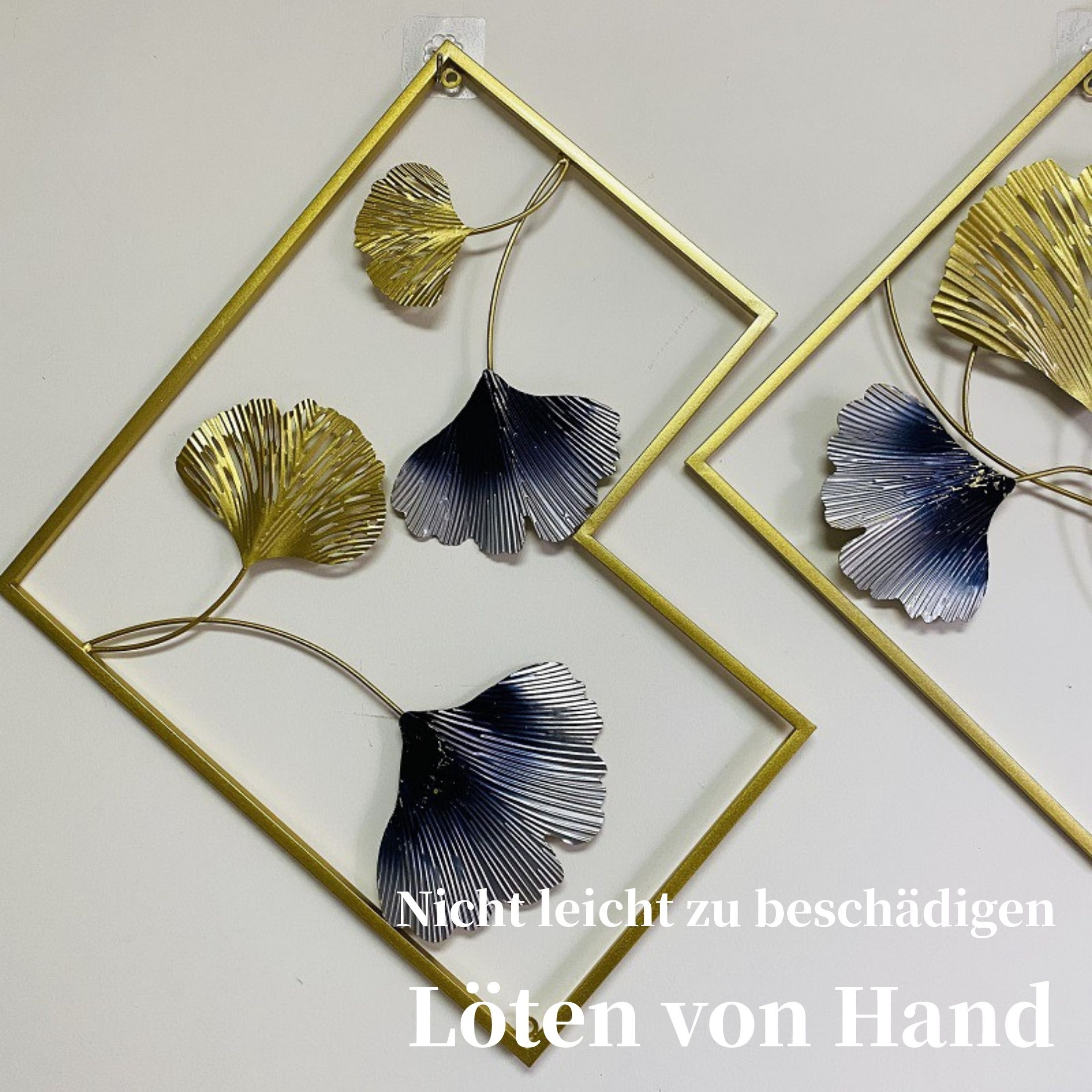 Wandkunst mit goldenen Rahmen und Ginkgoblatt-Designs in Gold und Blau. Der Text unten lautet 'Nicht leicht zu beschädigen'.