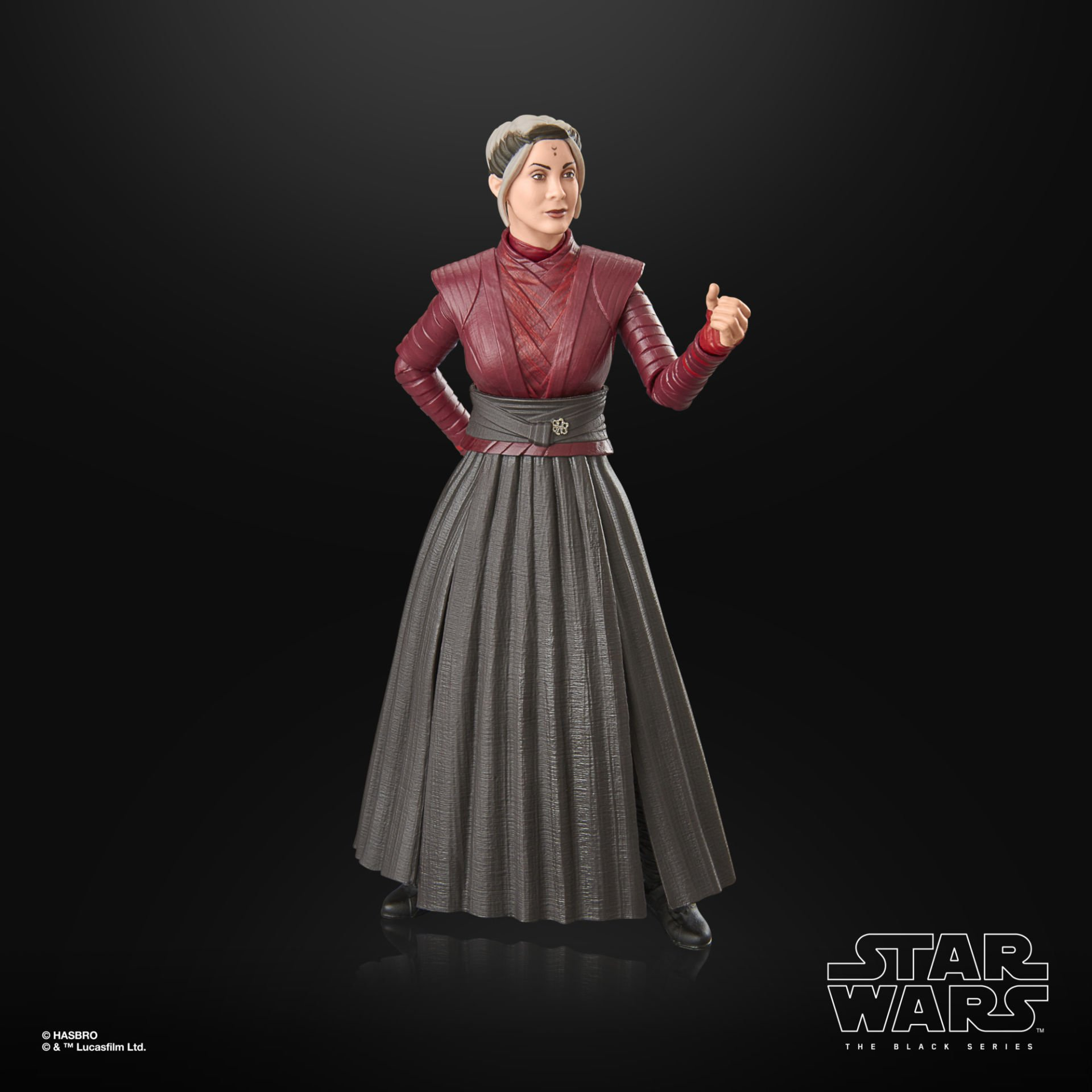 Una figura de Star Wars de una mujer en borgoña y gris. Gesticula con un pulgar hacia arriba, sobre un fondo negro.