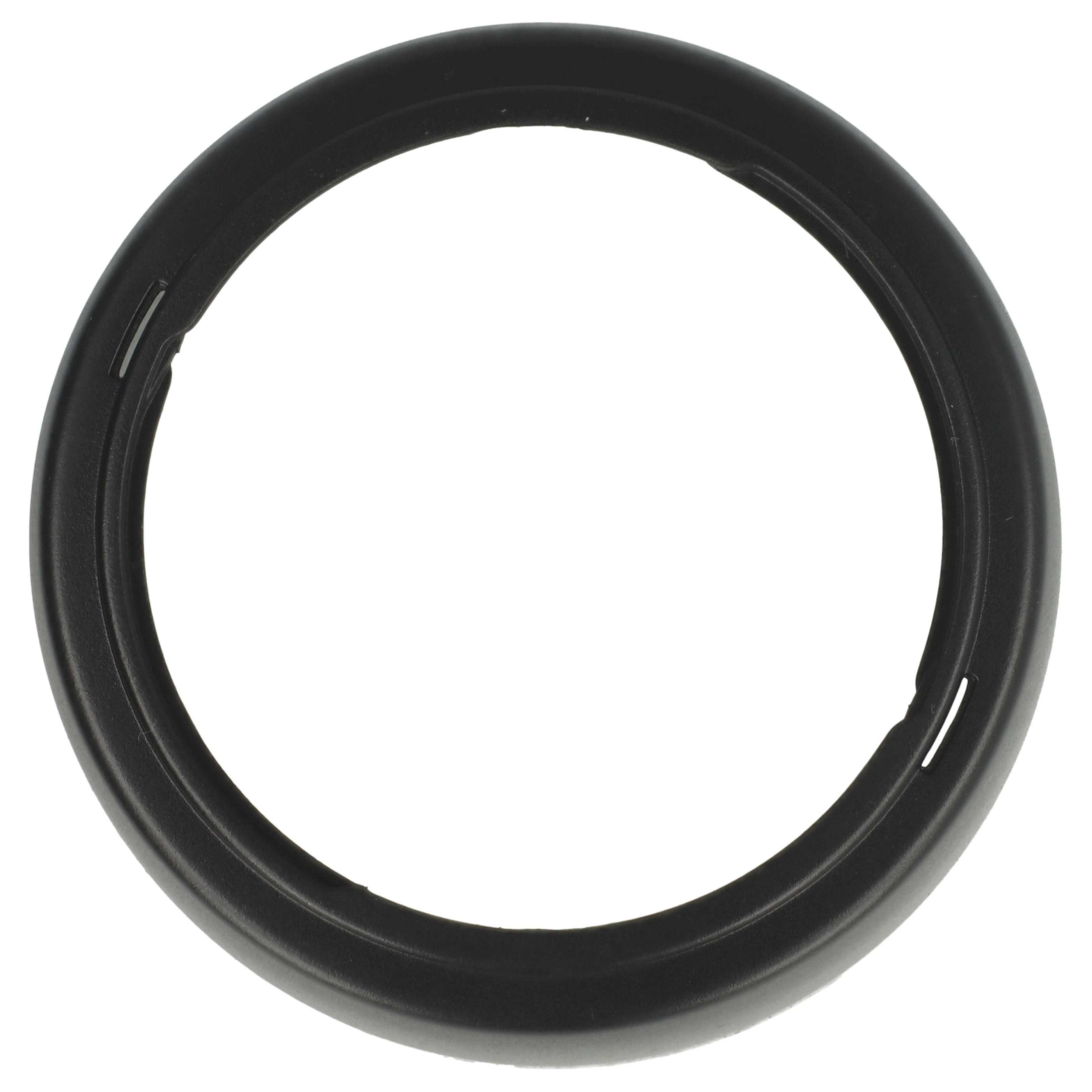 Ein schwarzes, kreisförmiges Objekt mit hohler Mitte, wahrscheinlich ein Ring oder Teil einer größeren Komponente. Der Hintergrund ist weiß.