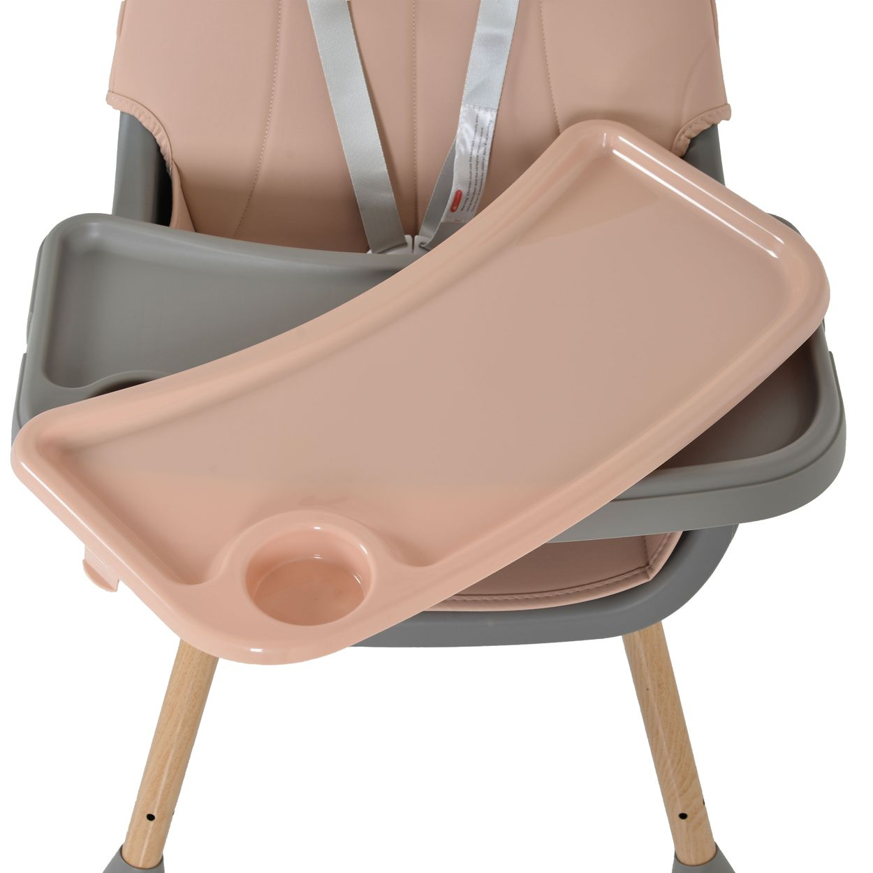 Ein Babyhochstuhl mit rosa Tablett und grauem Rahmen. Der Sitz ist rosa und die Beine sind aus Holz. Sicherheitsgurte sind sichtbar.