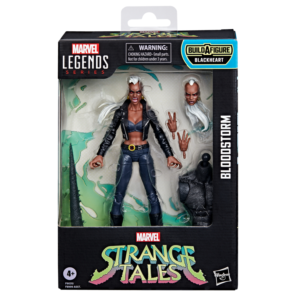 Eine Marvel Legends Bloodstorm Actionfigur in ihrer Verpackung. Sie hat eine schwarze Jacke, blaue Hose und weiße Haare. Enthält zusätzliche Hände und Kopf.