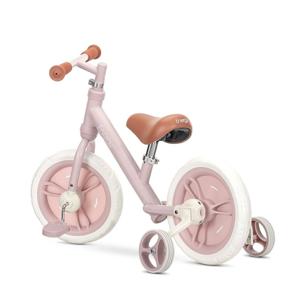 Ein rosa Laufrad mit braunem Lenker und Sitz. Es hat weiße Reifen und Stützräder.