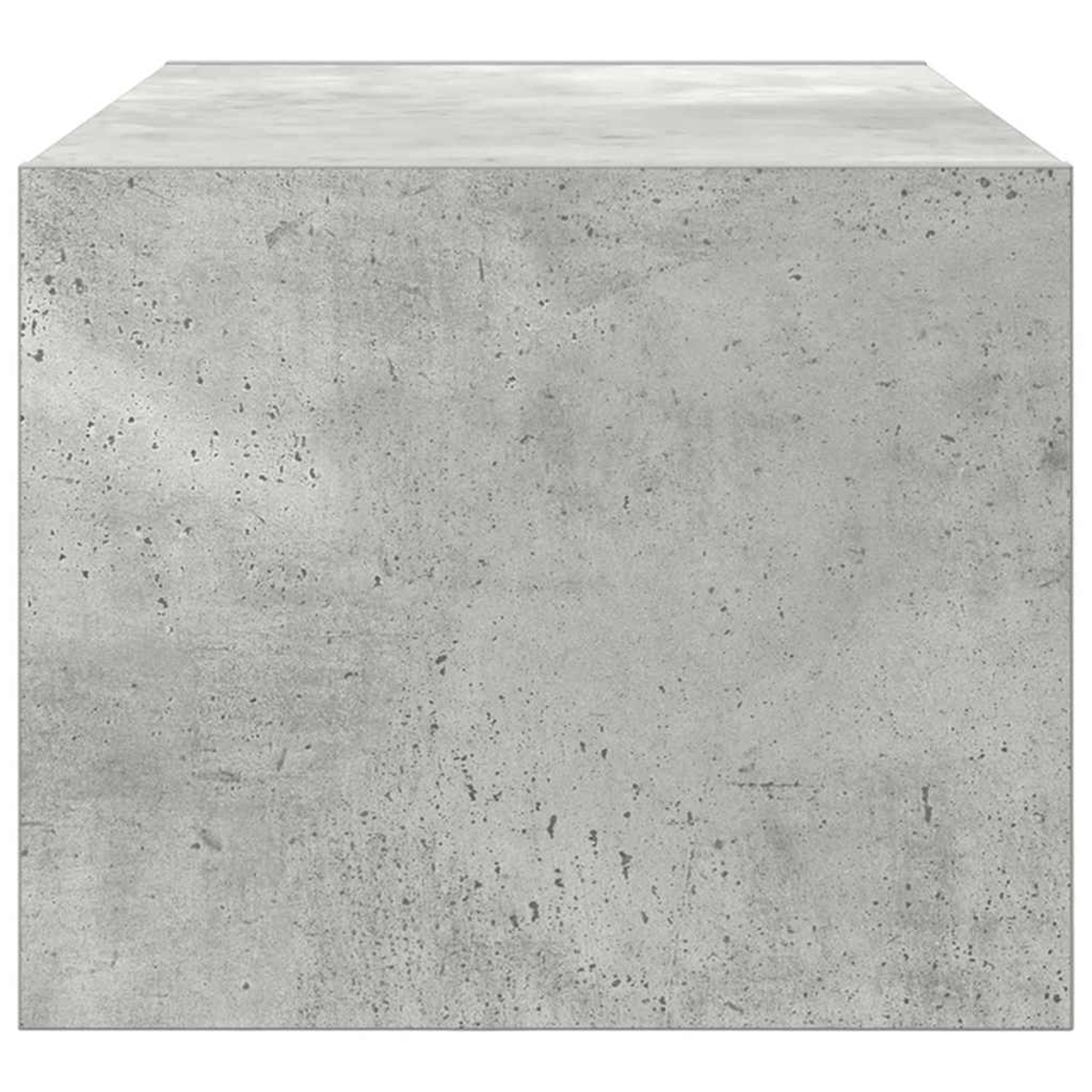 Ein quadratischer, grauer Betonblock. Die Oberfläche hat kleine dunkle Flecken und eine etwas hellere Oberseite.
