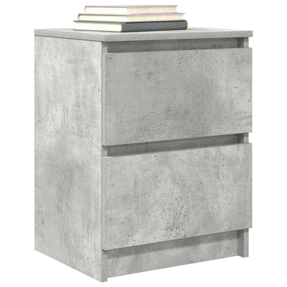 Ein grauer Nachttisch aus Beton mit zwei Schubladen. Obenauf liegen drei Bücher.