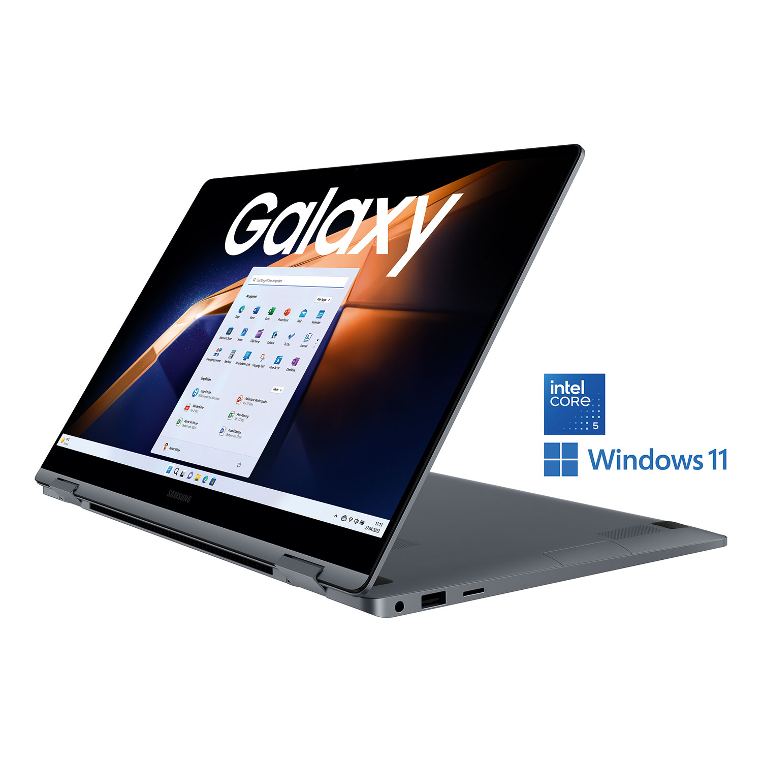 Srebrny laptop Samsung Galaxy jest otwarty, wyświetlając aplikacje. Ekran pokazuje Windows 11. Loga to Intel Core i Windows 11.