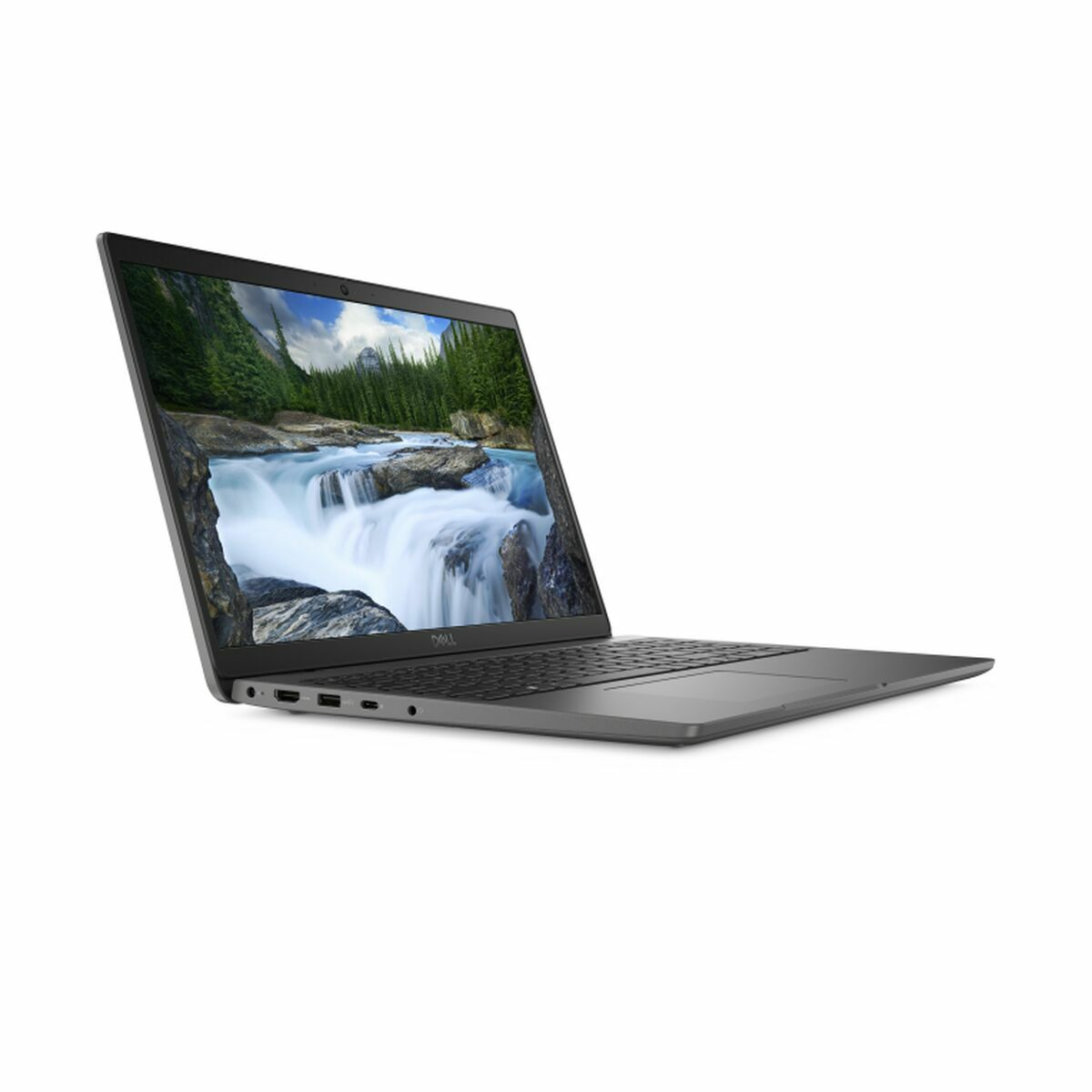 Una laptop gris está abierta, mostrando una escena de cascada. La laptop está sobre una superficie blanca. La pantalla muestra agua y árboles.