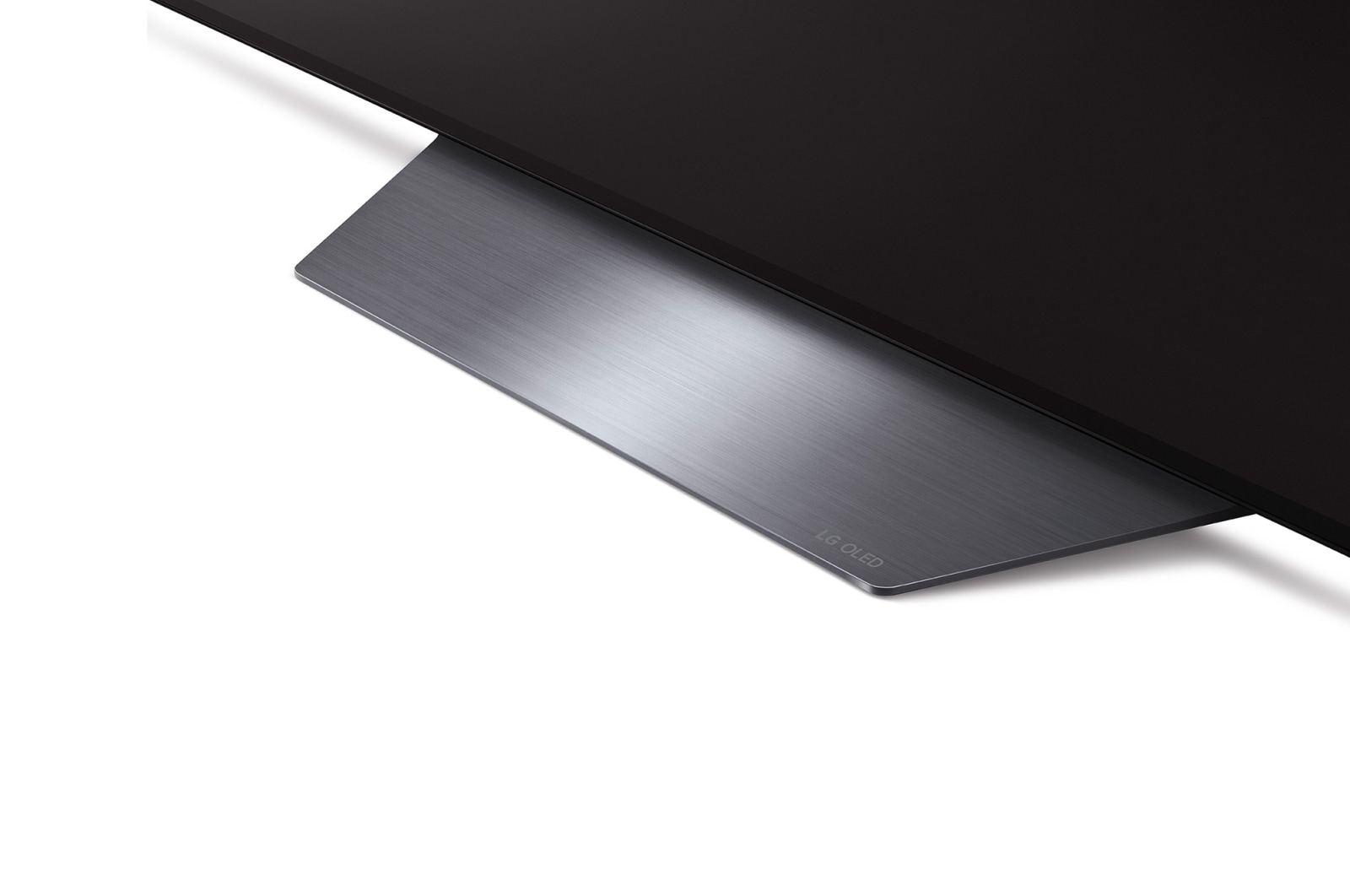 Primo piano di un supporto TV LG OLED. Il supporto è grigio metallizzato, con 'LG OLED' stampato. Lo schermo è nero.