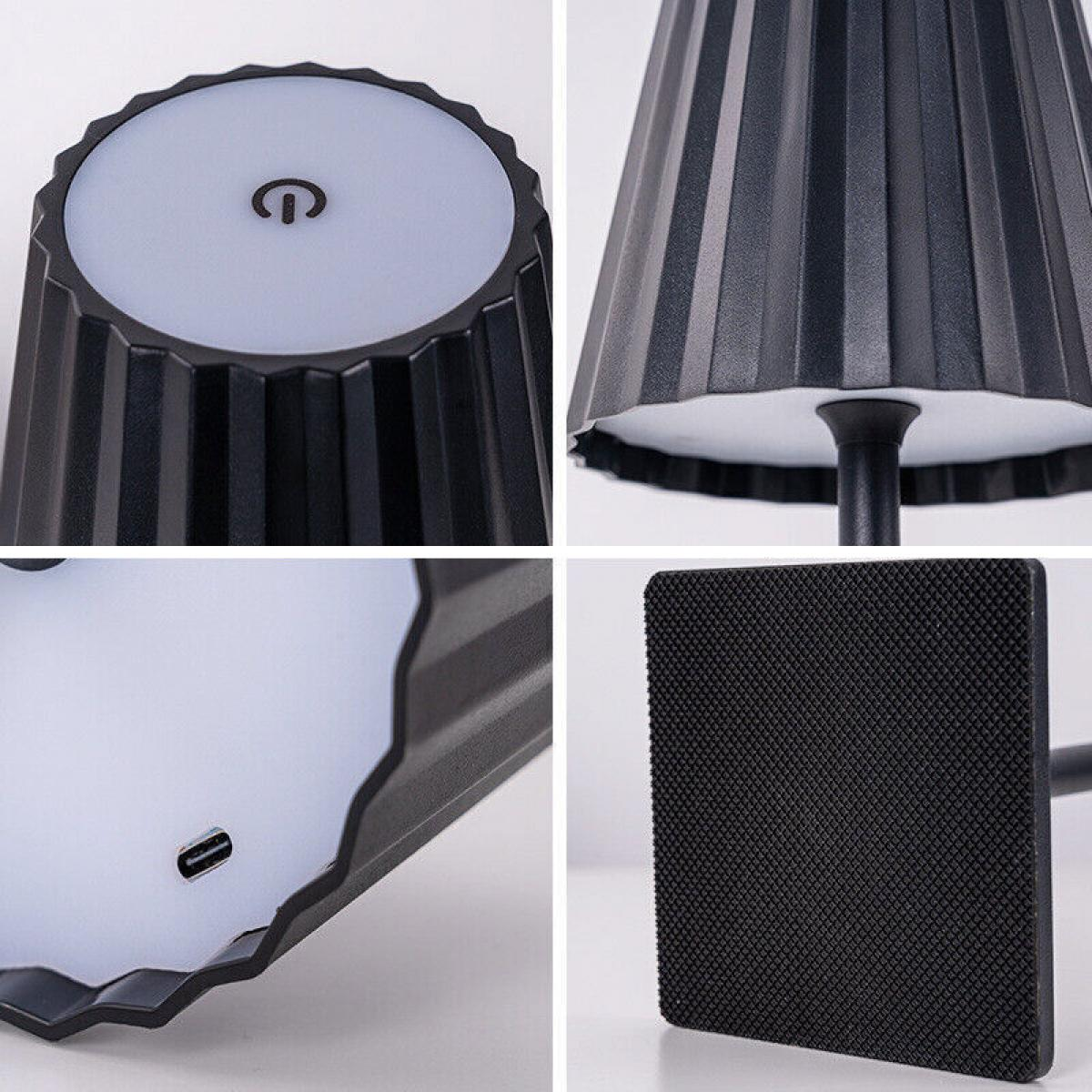 Nahaufnahmen einer schwarzen Tischlampe. Details umfassen den strukturierten Fuß, den Einschaltknopf, den Schirm und den Ladeanschluss.