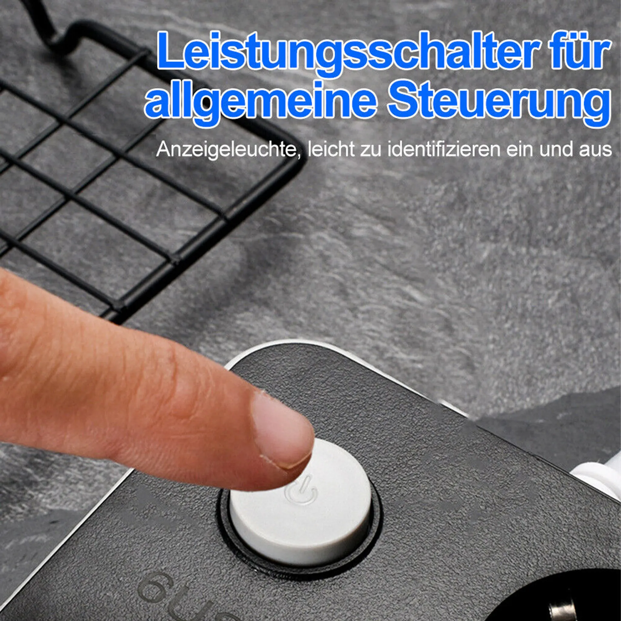 Ein Finger drückt auf einen weißen Einschaltknopf. Der Knopf befindet sich auf einem schwarzen Gerät mit deutschem Text darüber.