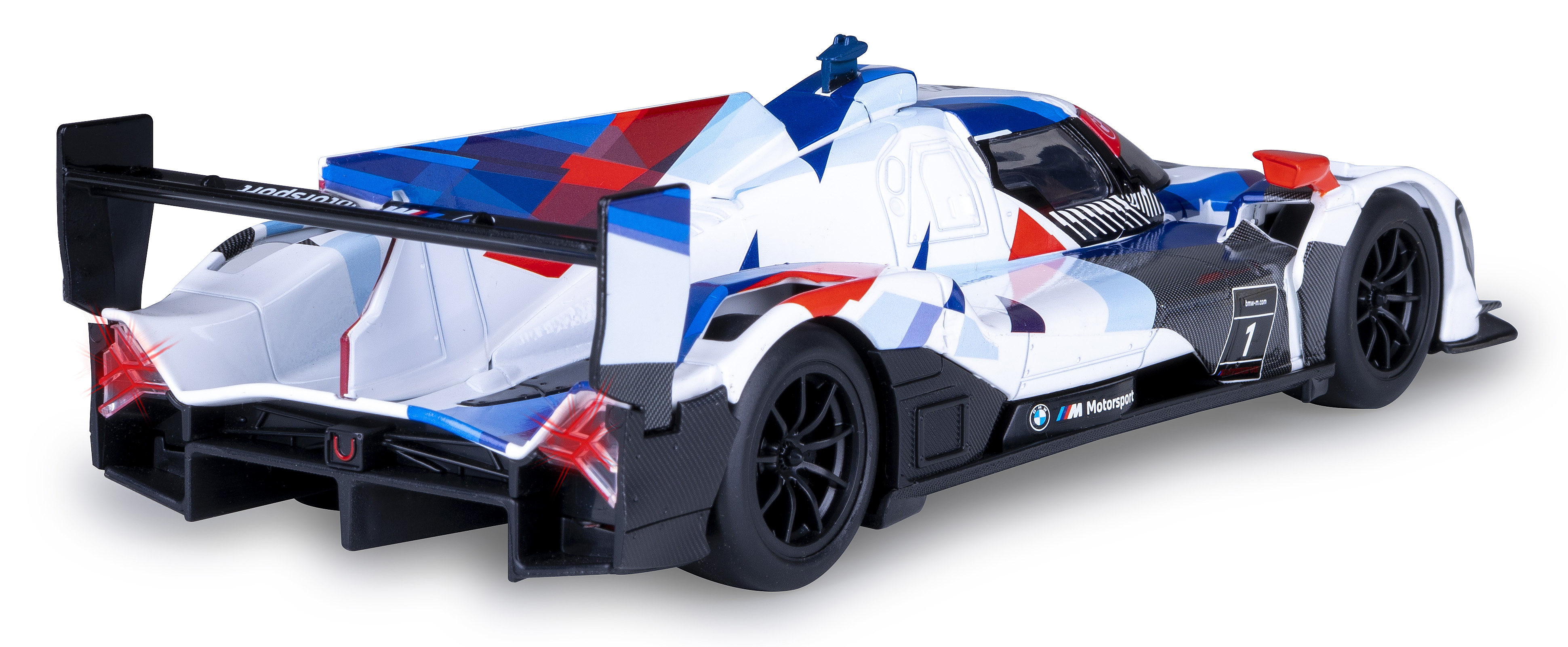 Ein Modellrennwagen. Er ist weiß mit roten, blauen und schwarzen Akzenten. Das Auto hat die Nummer 1 und das BMW Motorsport Logo.