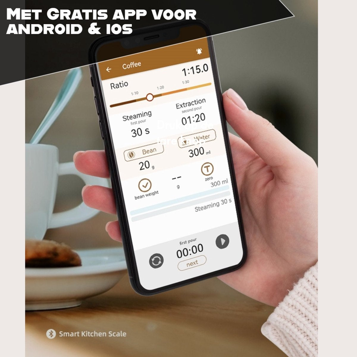 A hand holding a phone displays a coffee brewing app. The screen shows steaming and extraction times, water and bean quantities. A cup is in the background.