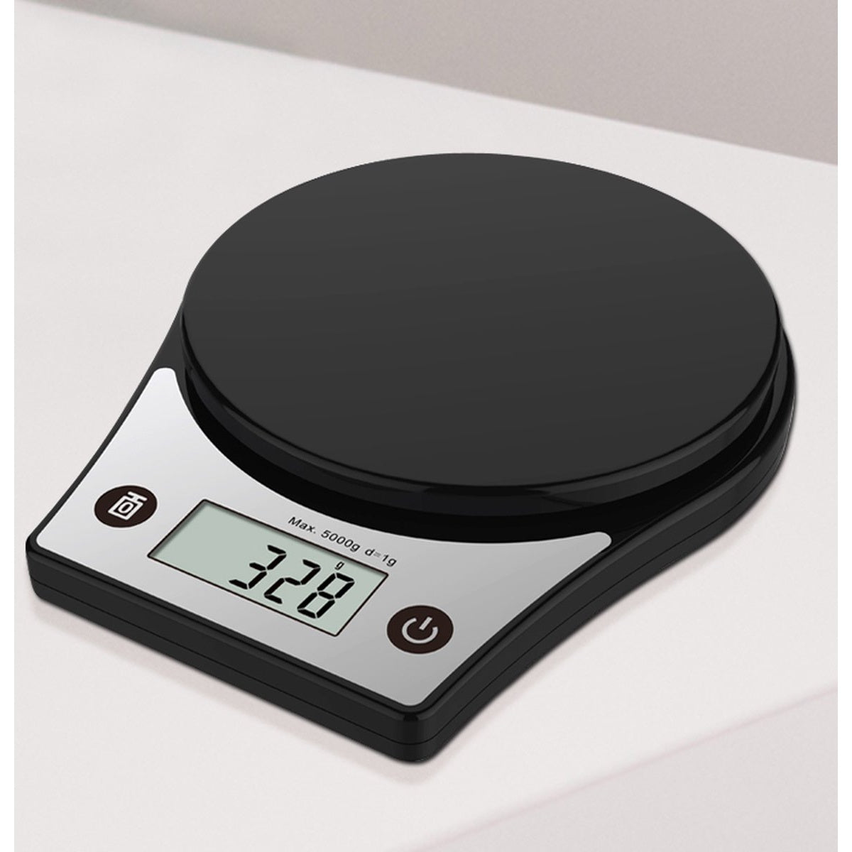 A black digital kitchen scale displaying 328. The scale has a round platform and a rectangular base with buttons and a digital display.