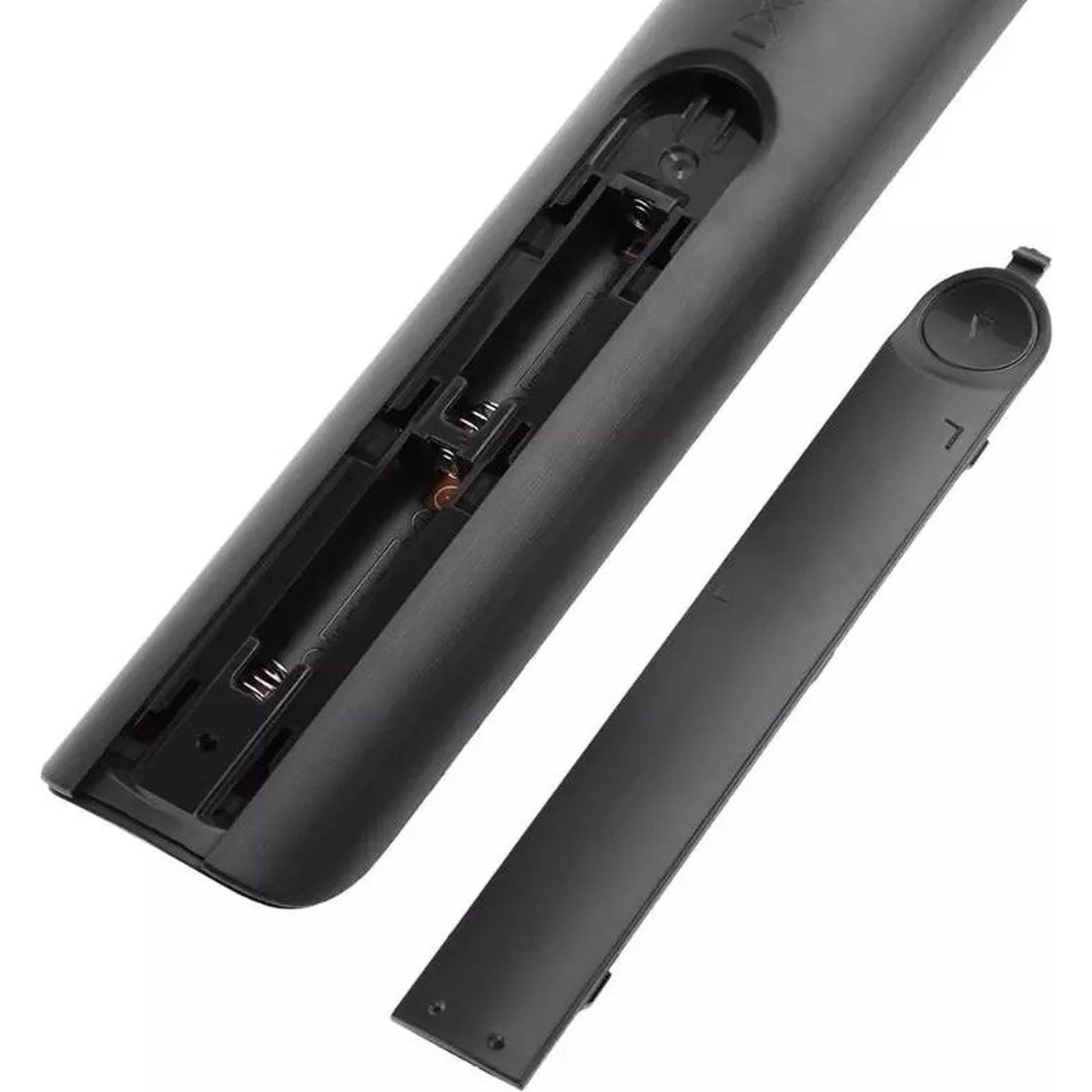 Black TV remote with open battery compartment. The battery cover is separate. The compartment shows the battery contacts.