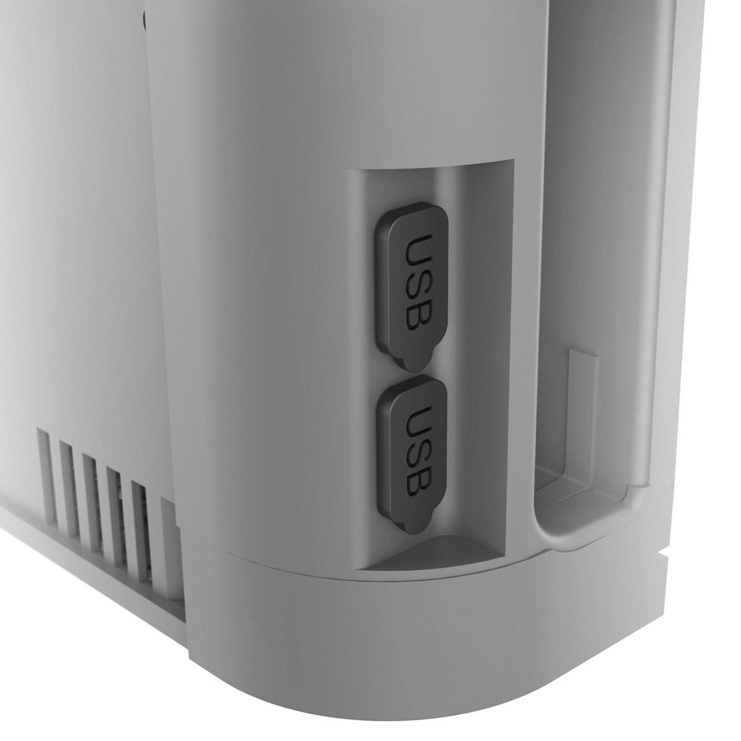 Primer plano de un dispositivo gris con dos puertos USB. Los puertos están etiquetados como USB. El dispositivo tiene un borde redondeado y una ventilación.