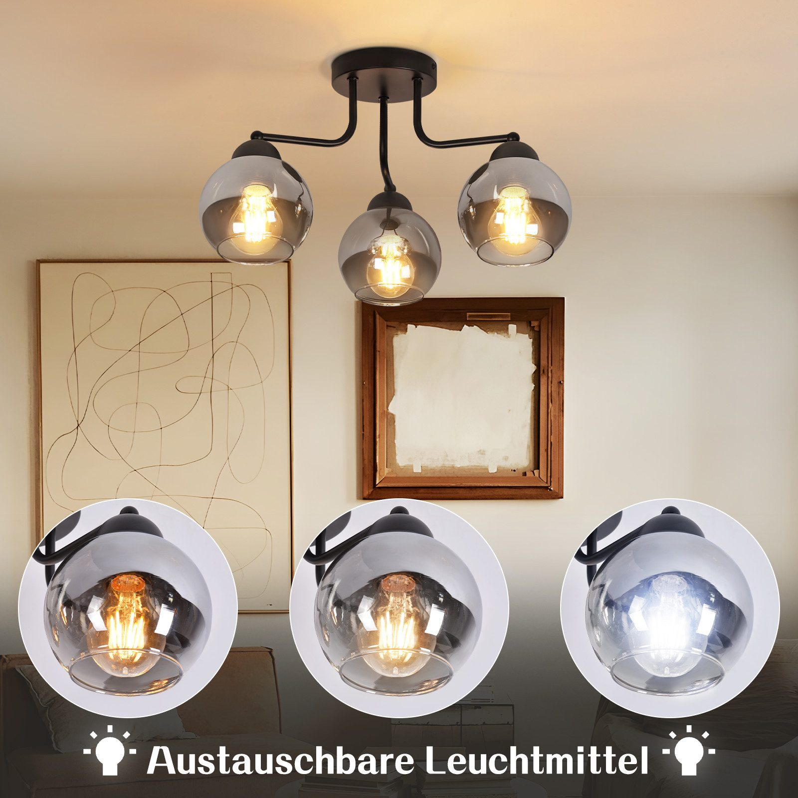 Una lampada da soffitto con tre paralumi sferici in vetro grigio, ognuno con una lampadina accesa. Lo sfondo mostra arte e un muro.