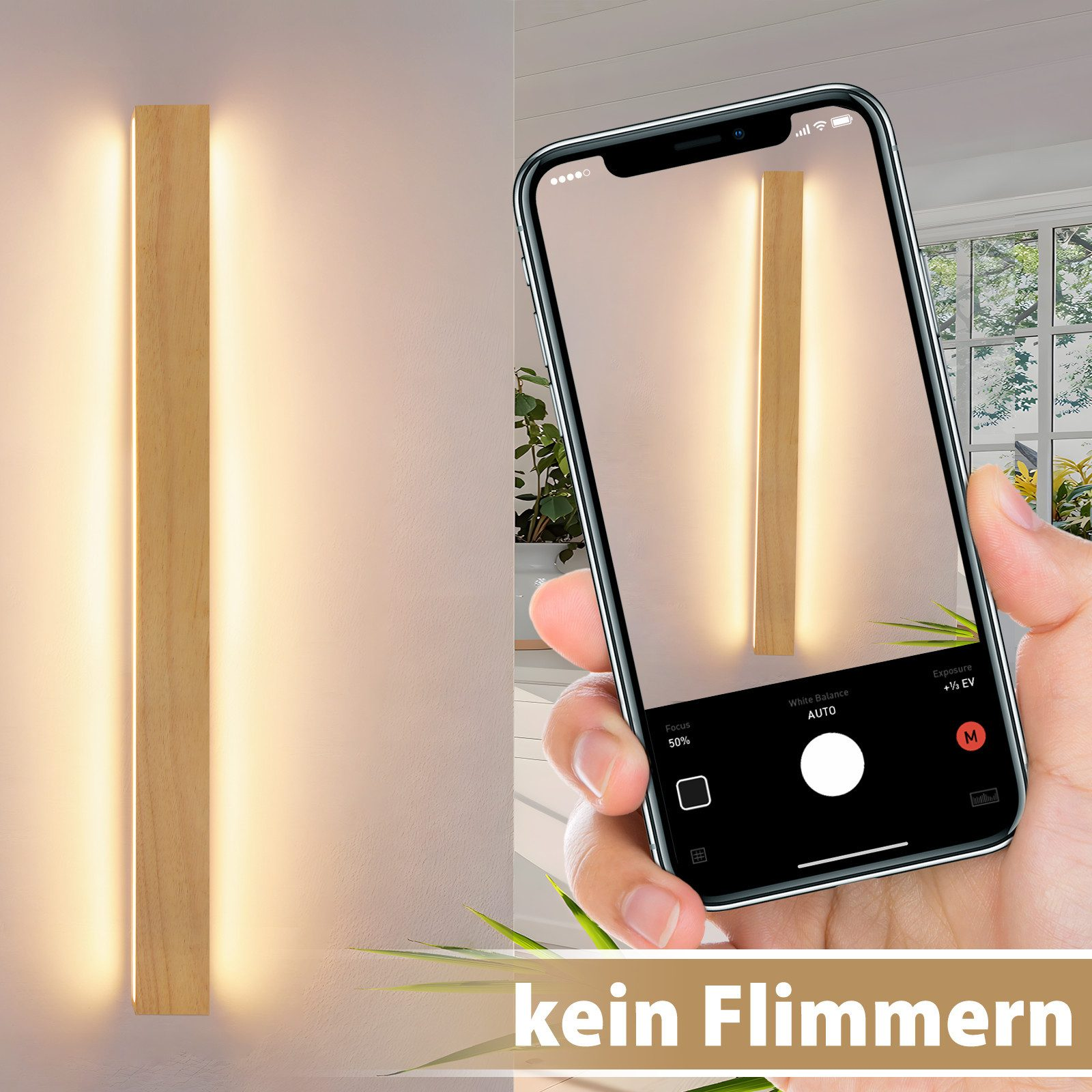 Ręka trzyma telefon, pokazujący drewnianą lampę ścienną. Tło ma lampę ścienną i okno.