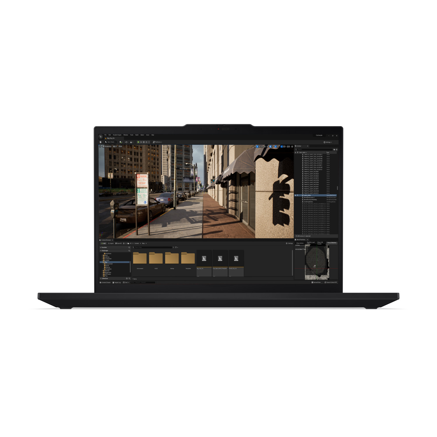Un laptop nero mostra una scena cittadina. Lo schermo mostra una strada con auto, edifici e un semaforo. Il laptop è su una superficie bianca.
