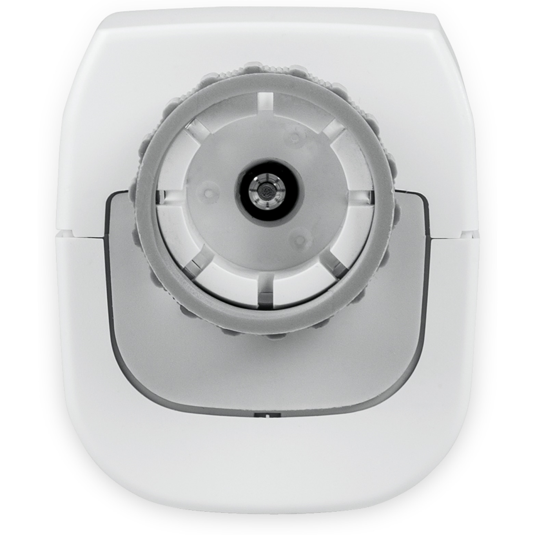 Draufsicht auf ein weißes Gerät mit einem grauen Drehrad. Das Rad hat eine zentrale schwarze Öffnung.
