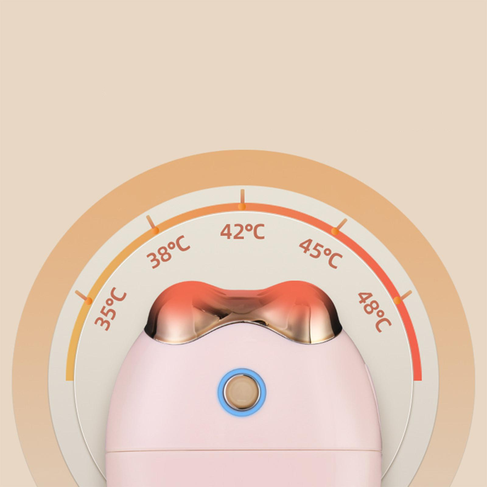 Ein rosa Schönheitsgerät mit Temperaturanzeigen. Es hat einen rosa Körper, goldene Akzente und eine Temperaturanzeige.