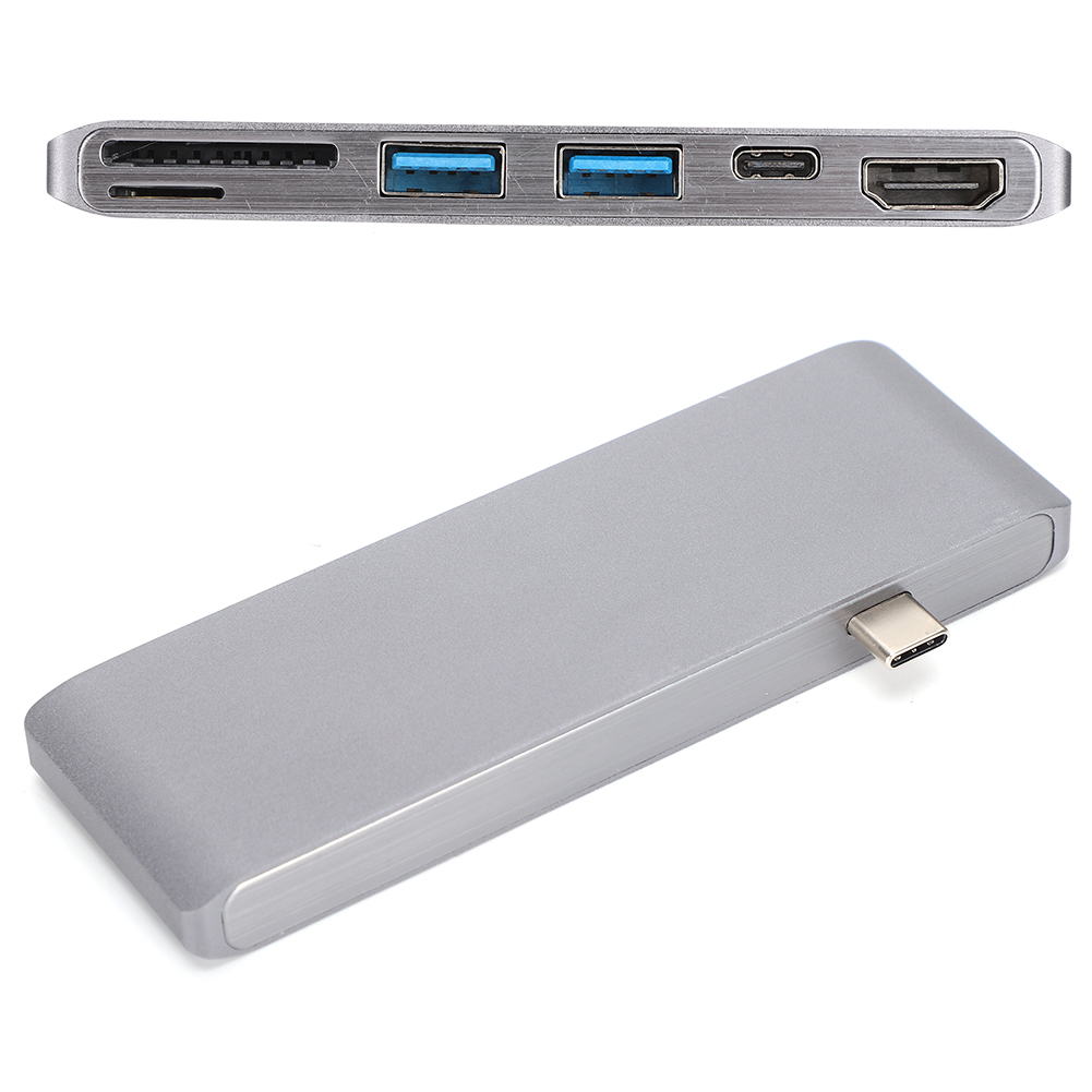 Ein silberner USB-Hub mit mehreren Anschlüssen. Er verfügt über USB-, HDMI- und SD-Kartensteckplätze. Ein USB-C-Anschluss ragt heraus.