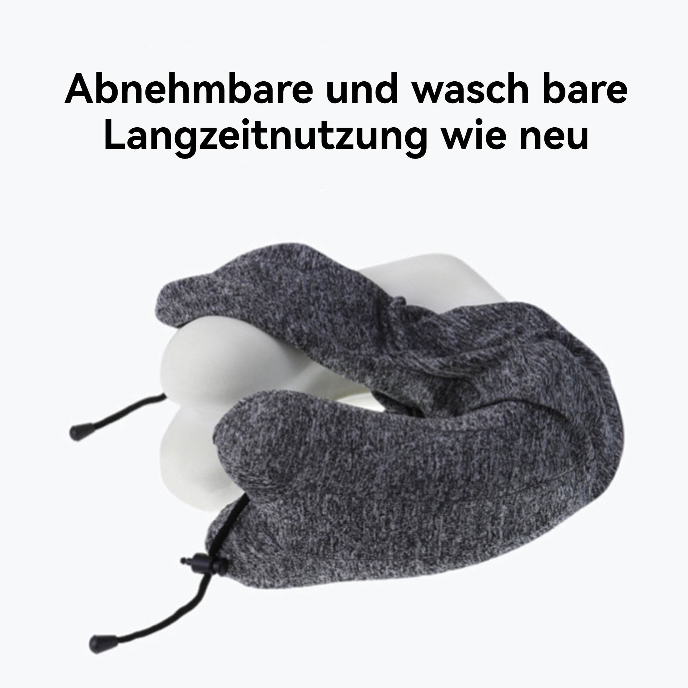 Gezeigt wird ein weißes Reisekissen mit grauem Bezug. Es hat schwarze Kordelzüge. Der Text oben lautet 'Abnehmbar und waschbar'.