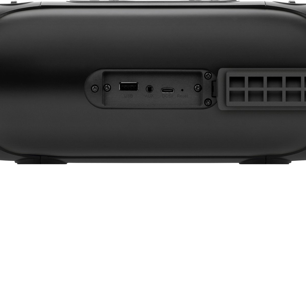 Close-up of a black speaker. Visible are ports for USB, AUX, DC5V, and a reset button. The background is white.