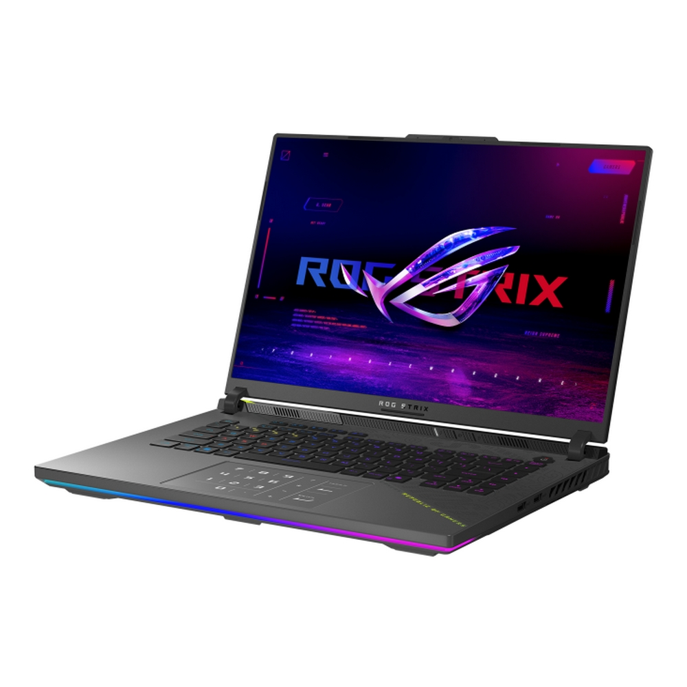 Un laptop nero è aperto, mostrando uno schermo colorato con il logo ROG Strix. Tastiera e touchpad sono visibili. Il laptop è angolato.
